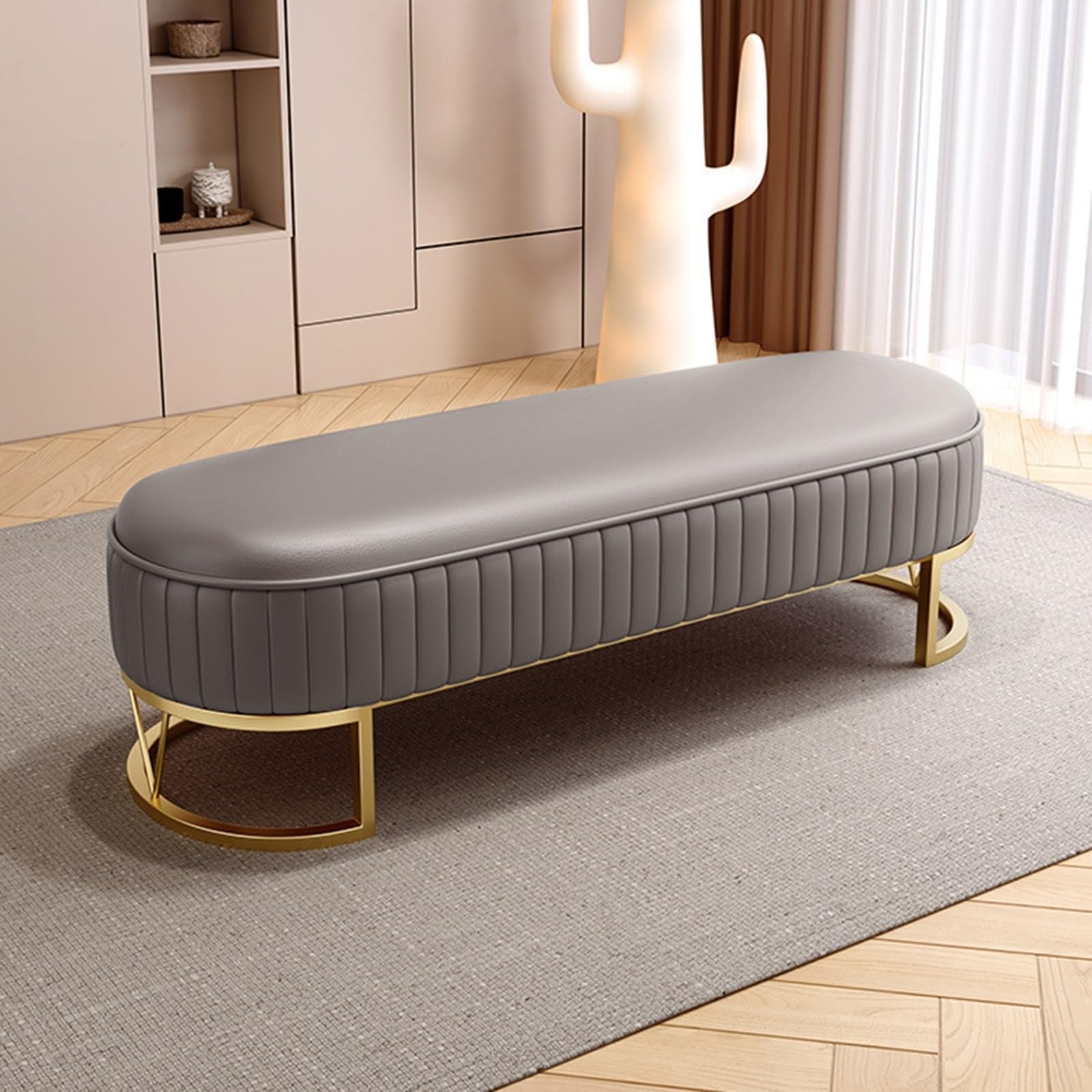 Banc de 120 cm gris rembourré avec pieds dorés pour chambre et salon chic