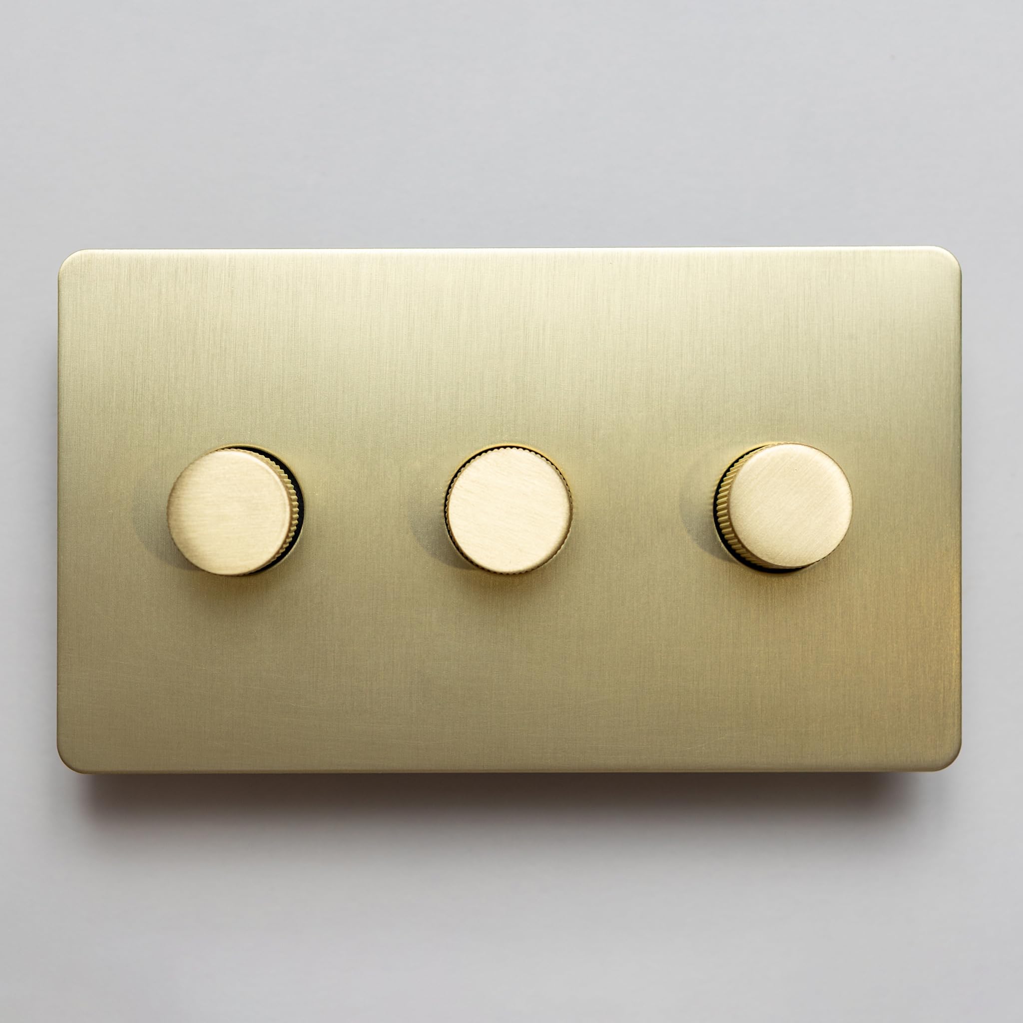 Satin Brass Straight Knurled Switches and Sockets | Screwless Front Plate (3 Gang Dimmer - 2 Way) — image 1