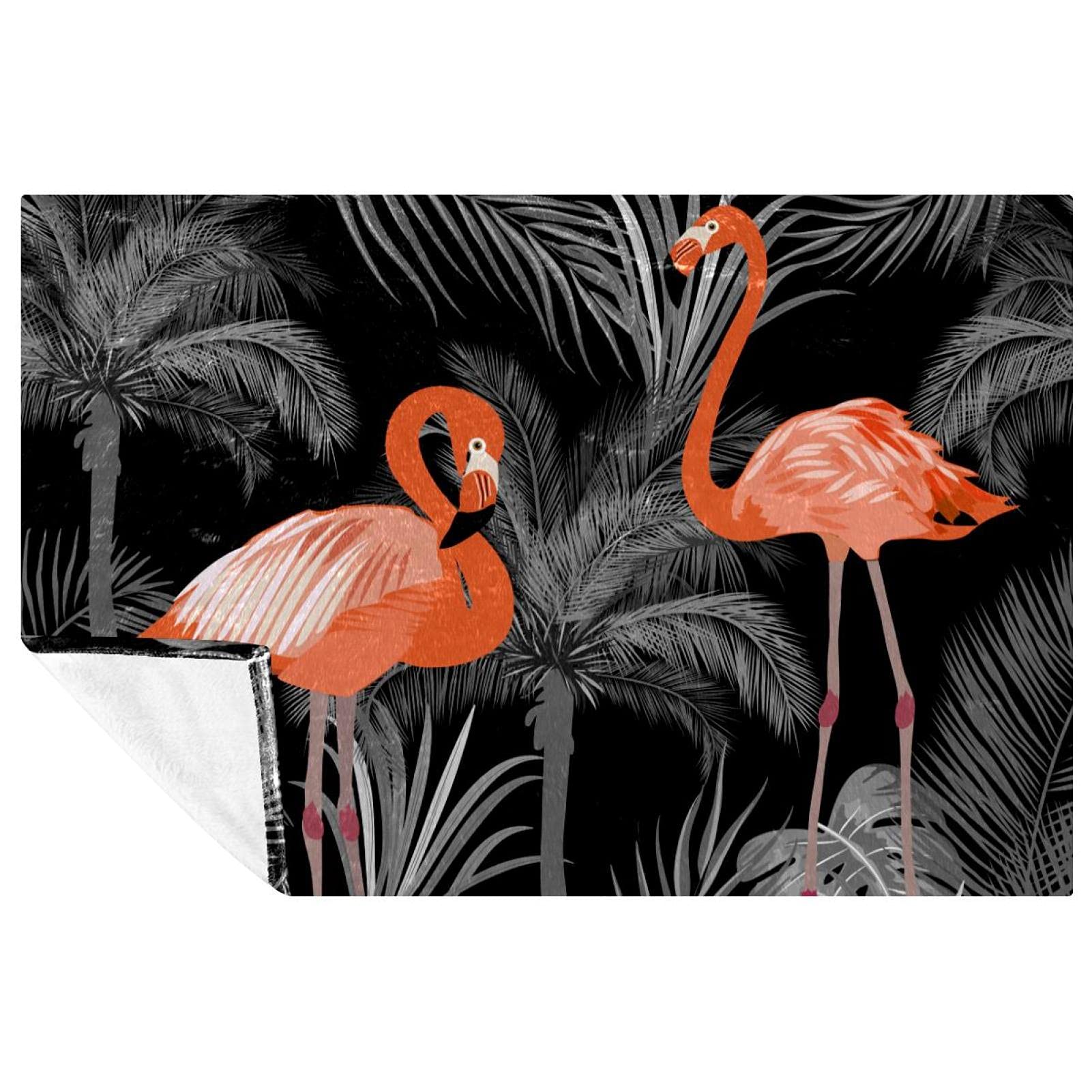 Couverture flamant rose noir : la solution contre le froid sur le lit ou au camping