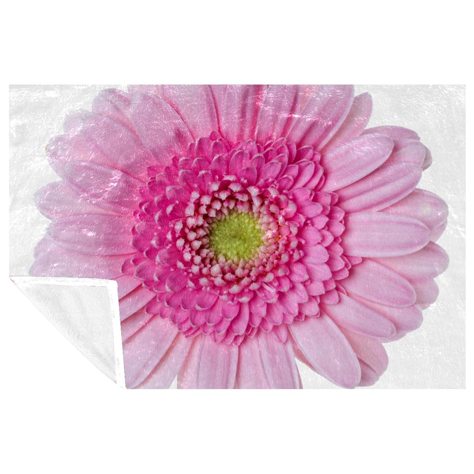 Couverture douce marguerites roses, un cocon de chaleur réconfortant pour toute la famille