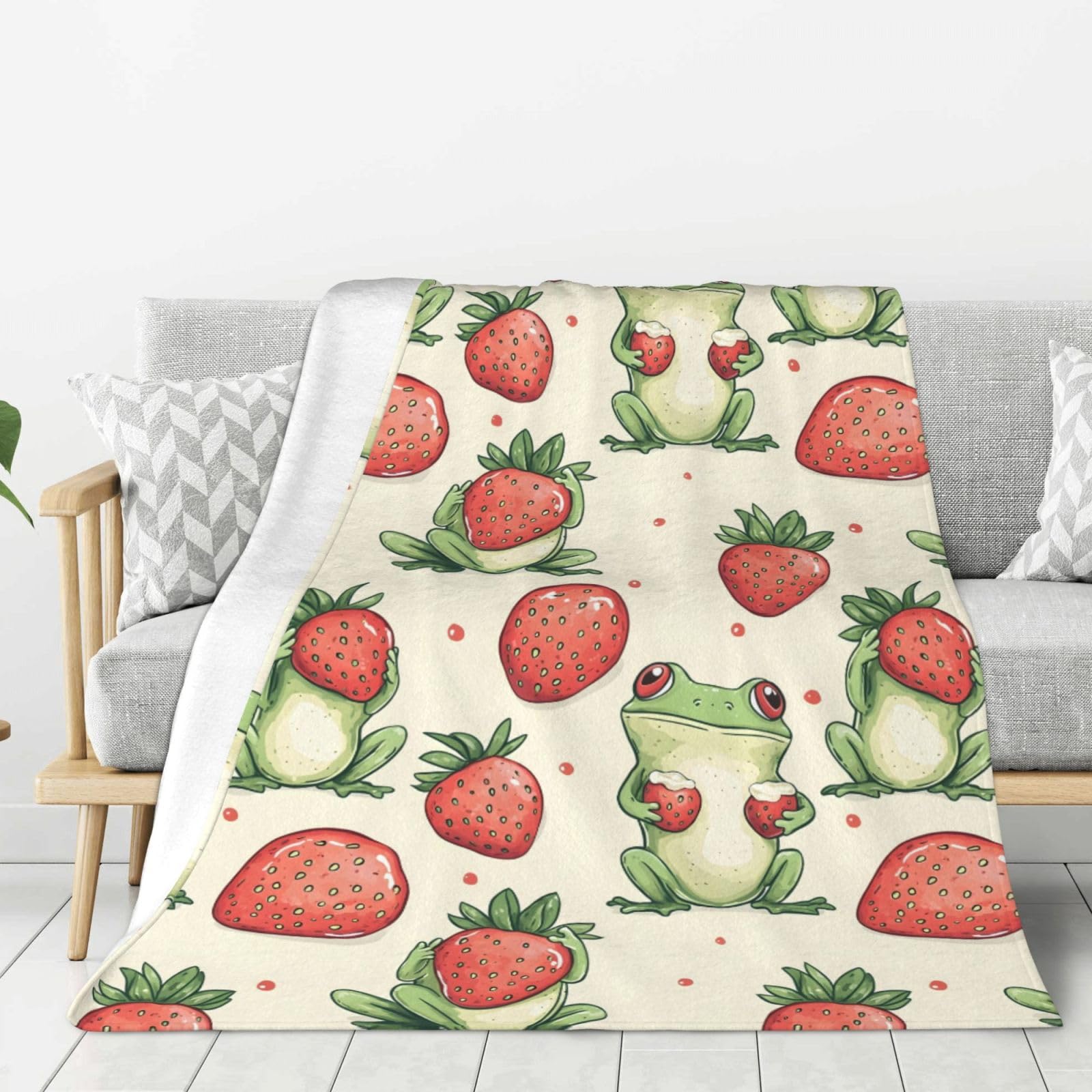 Couverture grenouille fraise pour cocooning sur le canapé lors des soirées fraîches