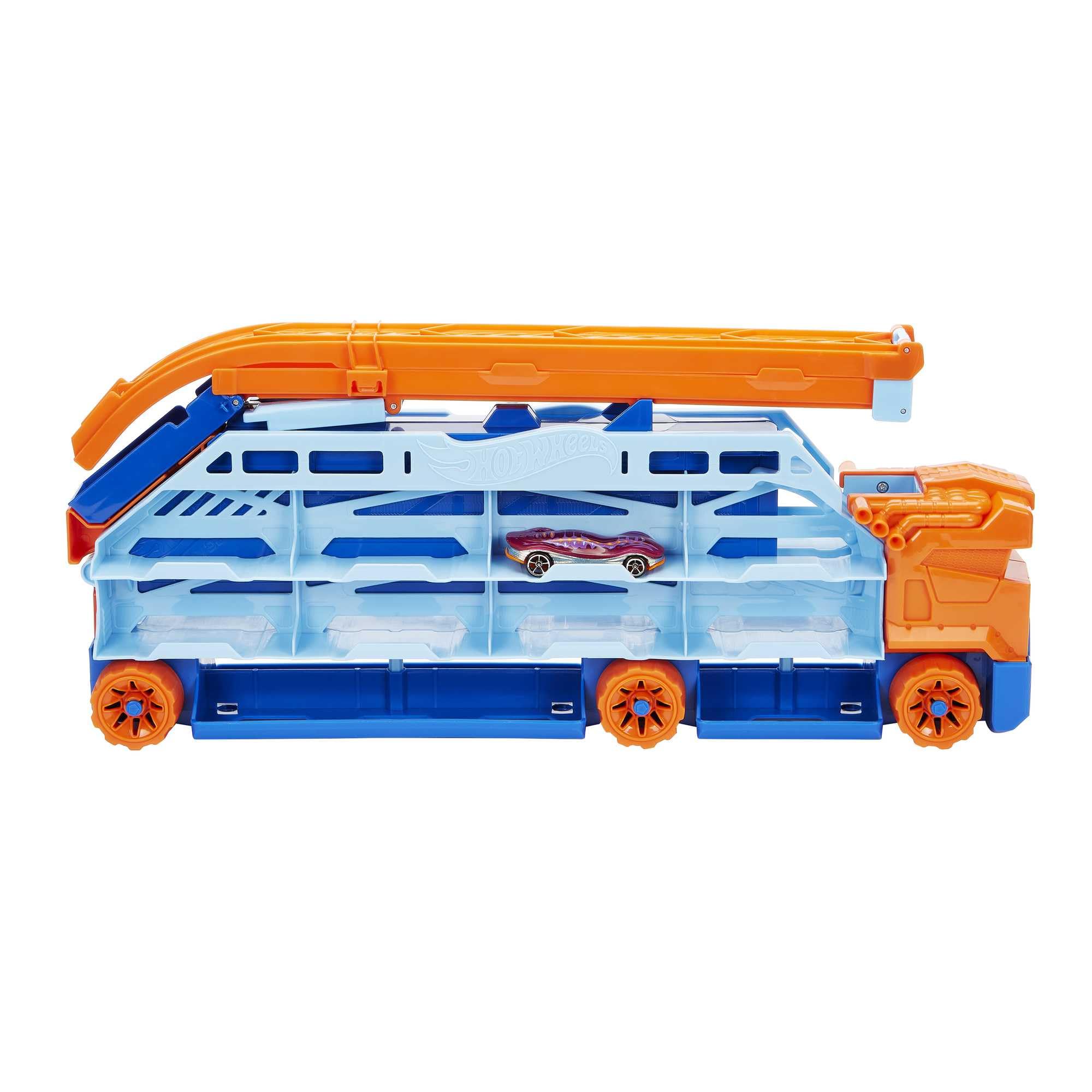 Hot Wheels - Autotrasportatore a Caduta Libera, con 1 macchinina, contiene più di 20 veicoli in scala 1:64, si trasforma in una pista con discesa da 60 cm, Giocattolo per Bambini 4+ Anni, HDY92