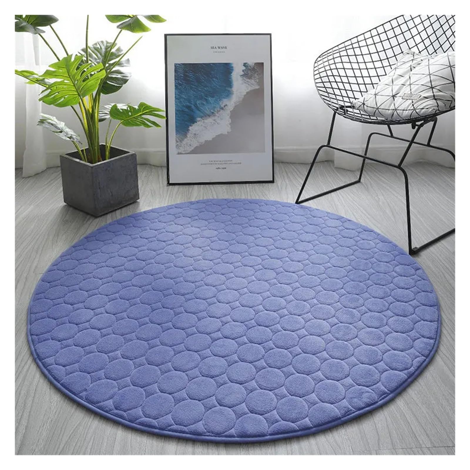 Tapis de sol rond bleu matelassé pour créer un coin lecture cosy dans votre salon