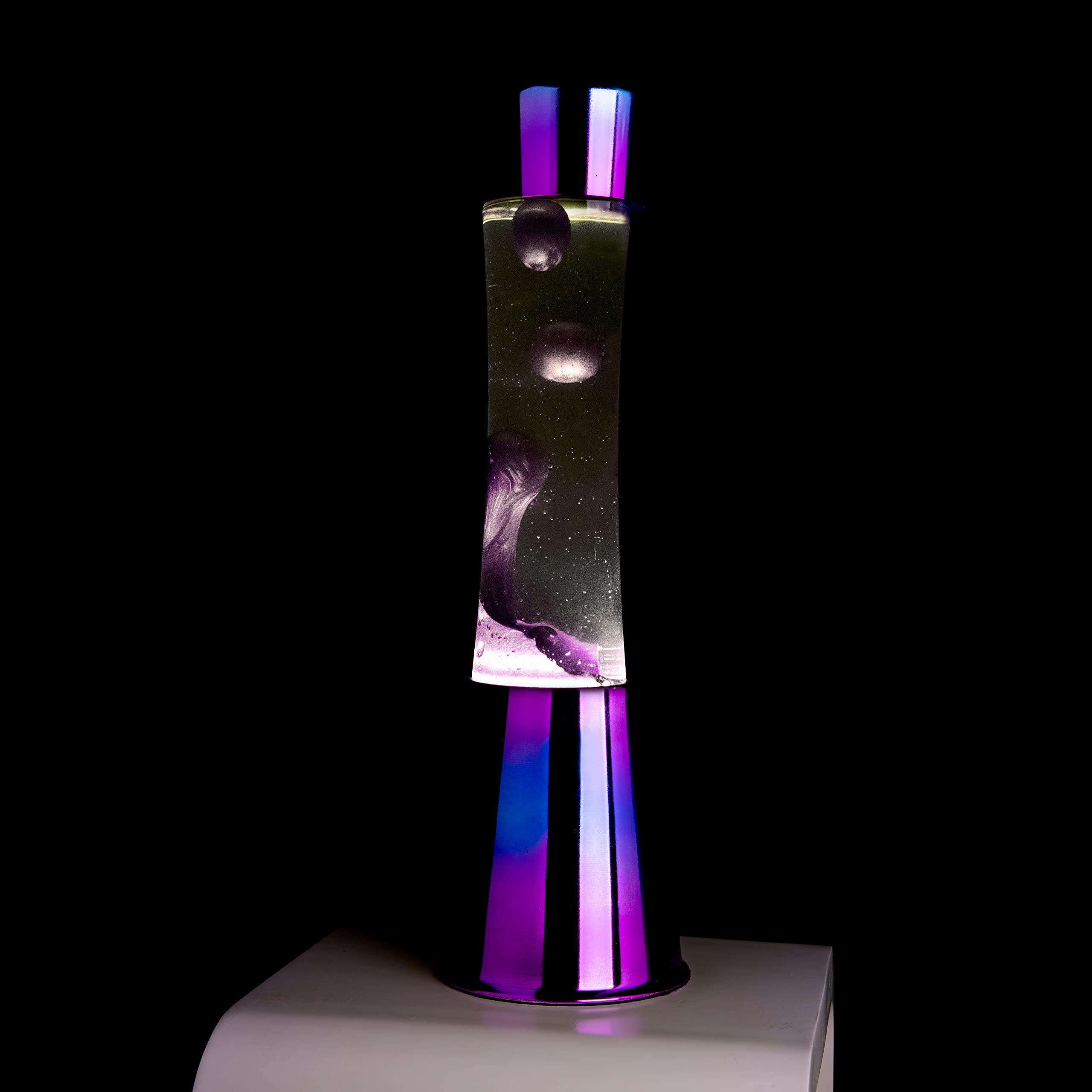 Fisura - Lámpara de lava iridiscente. Base iridiscente, líquido transparente y lava morado metálico. Lámpara efecto relajante. Con bombilla de repuesto. 11 cm x 11cm x 39,5 cm.