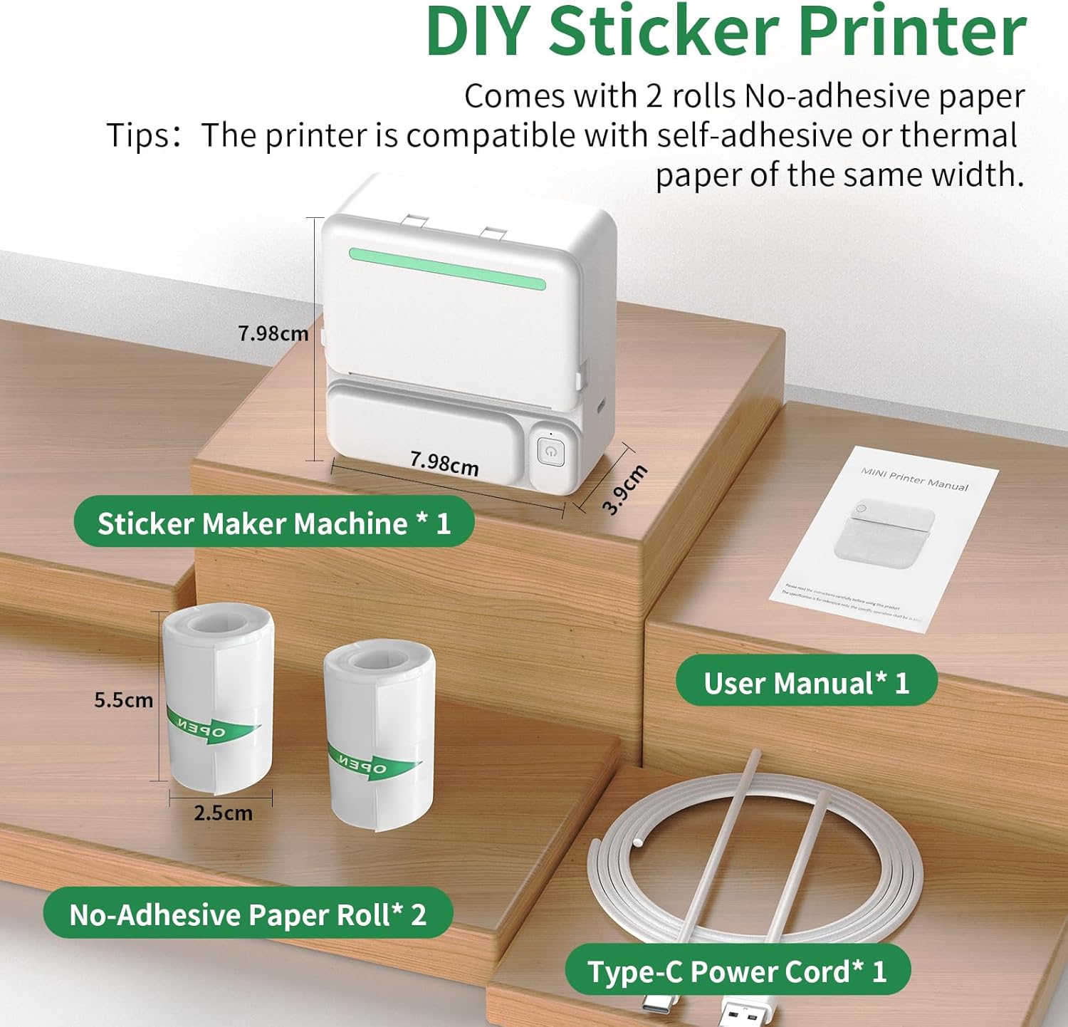 Contents of the kazazoo Mini Thermal Printer package, including the printer, two rolls of paper, a USB-C cable, and a user manual.