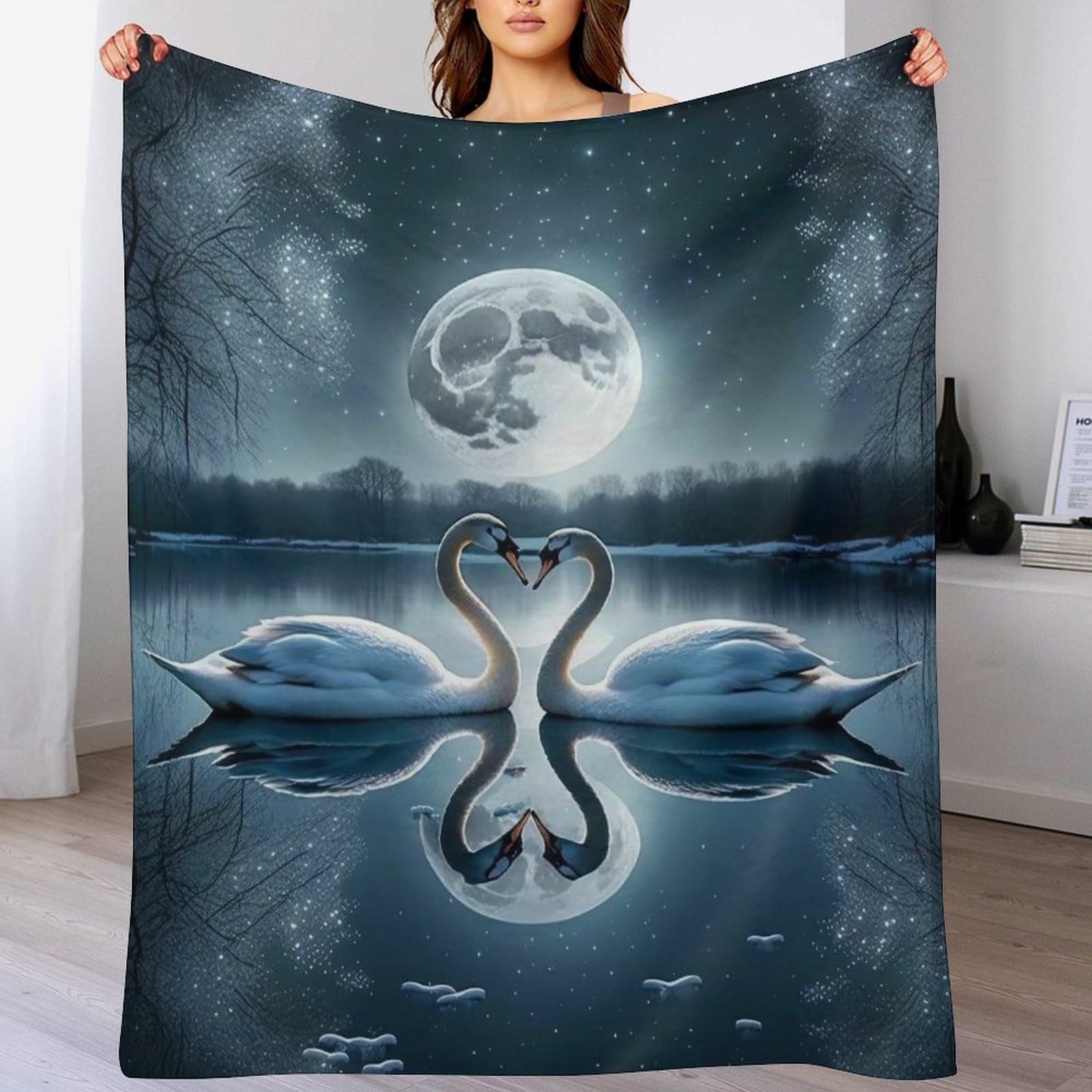Couverture cygne douce et douillette pour cocooning sur le canapé