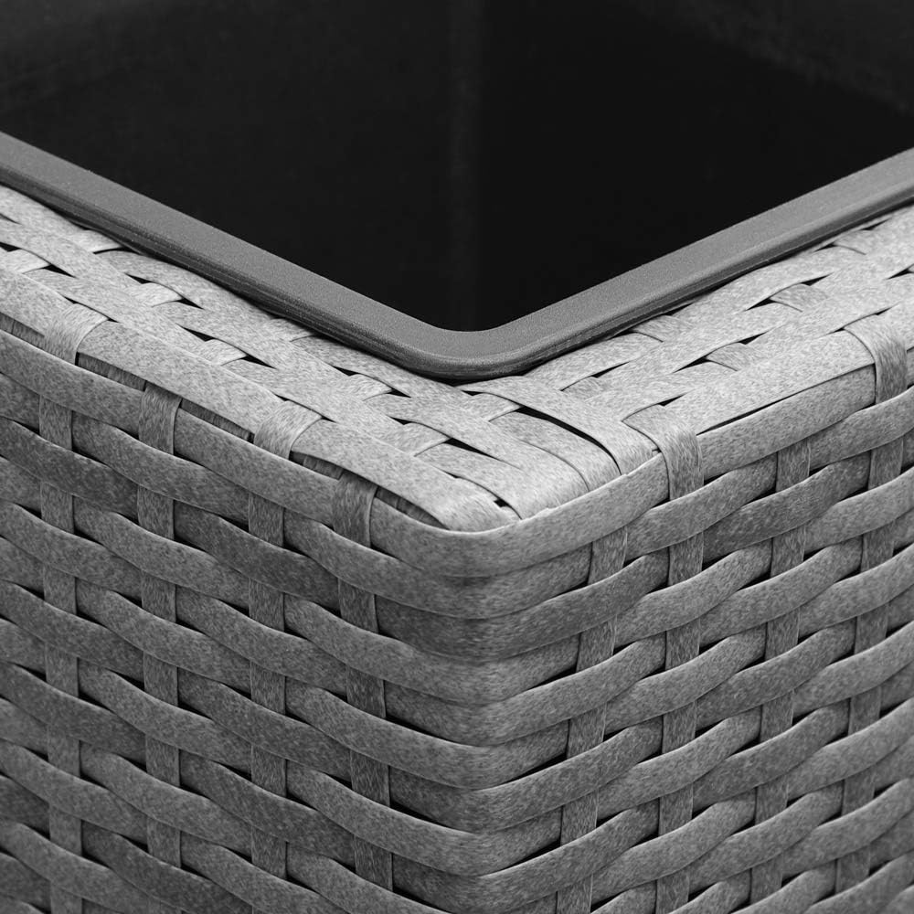 Close-up of an inner pot being placed into the polyrattan planter frame