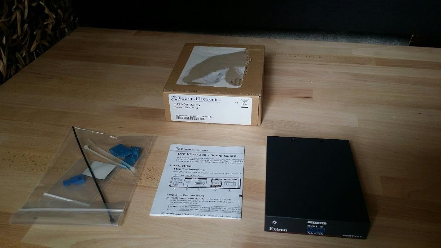 Extron DTP HDMI 230 Rx unboxed contents including unit, manual, and small parts