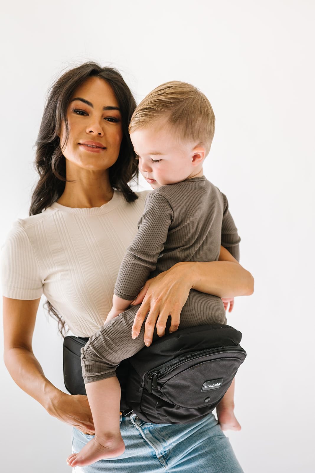 Tushbaby Hip Carrier for Babies & Toddlers (Black) - Safety-Certified, Machine Washable Child Waist Seat for One Hand Support with Multi-Pocket Storage, 23”- 44” Waist, Holds Kids 0-3 yrs up to 45lbs