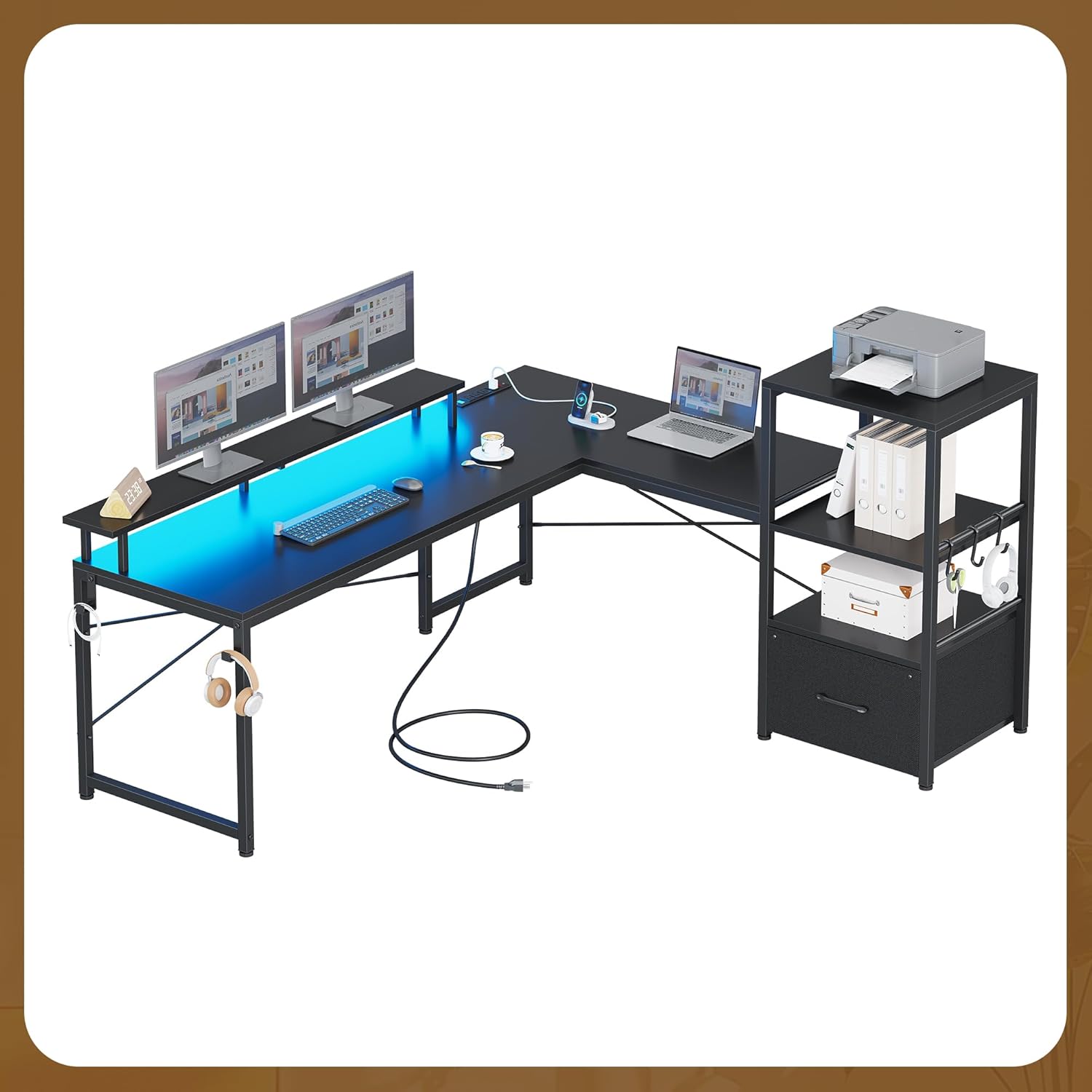 MSmask L-Shaped Desk with LED lights and power outlets, shown with two monitors, a laptop, and organized shelves.