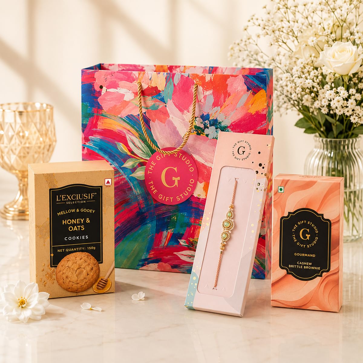 THE GIFT STUDIO.COM | Designer Serenade Rakhi Hamper | Green Stone & Pearl Rakhi, Oat & Honey Cookies, Cashew Brittle & Floral Gift Bag | Raksha Bandhan Gift-image-3