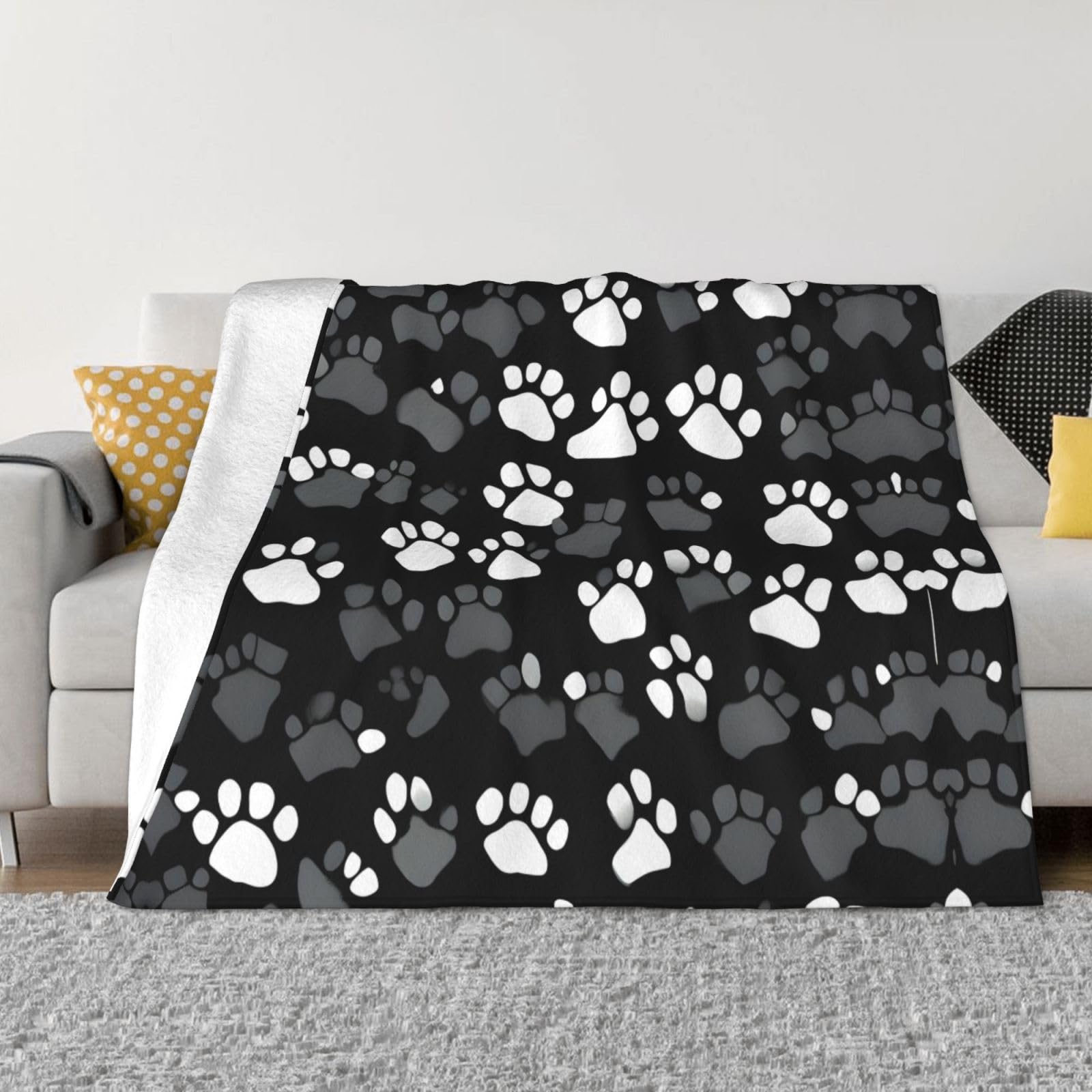 Couverture polaire doudoune à motif patte pour soirées cocooning sur canapé et lit de chambre