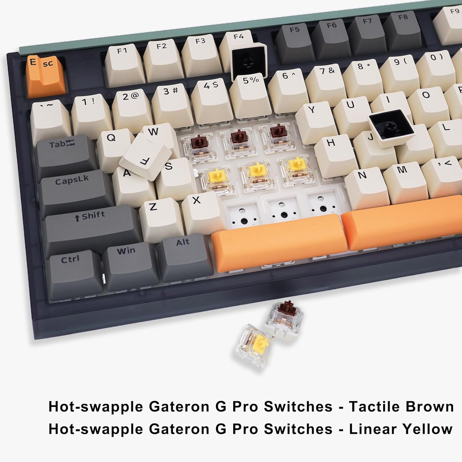 Image showing the hot-swappable Gateron G Pro switches (linear yellow and tactile brown) removed from the keyboard, with keycaps also removed.