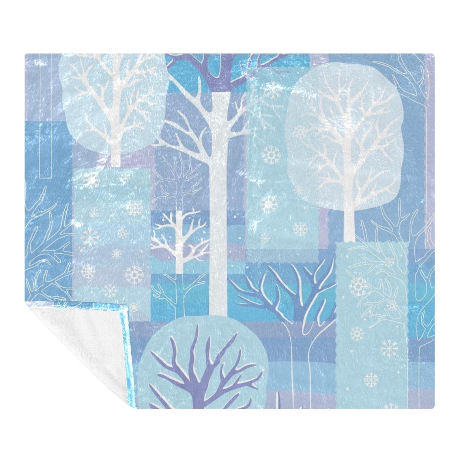 Couverture polaire flocons de neige bleue pour un hiver cocooning au salon