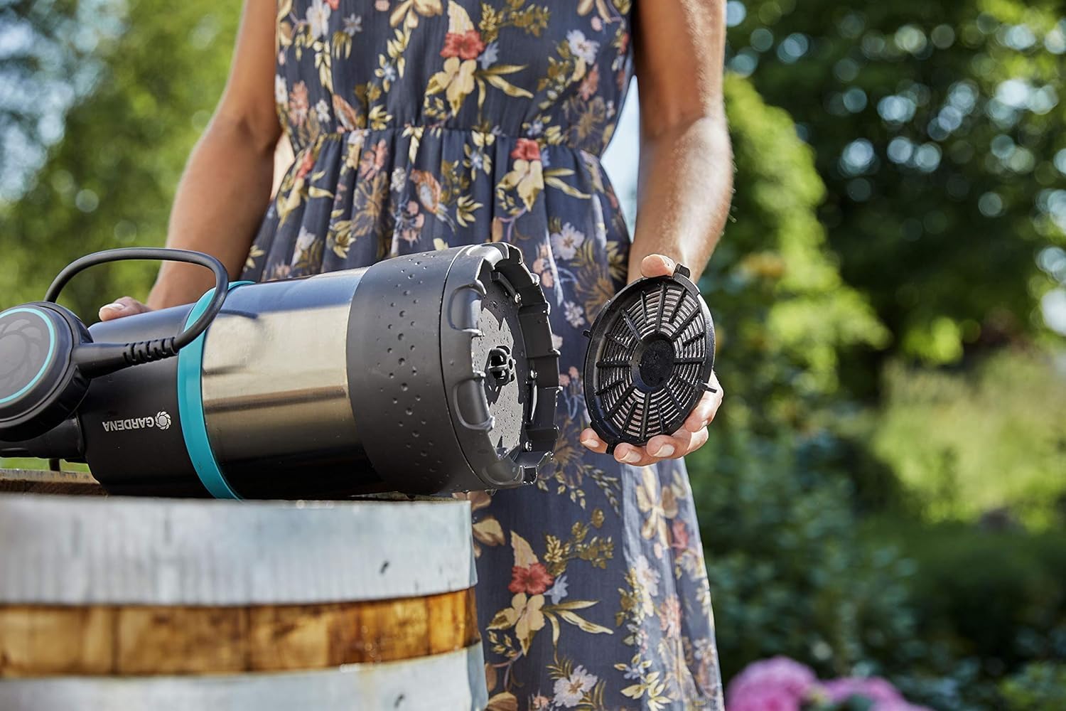 Gardena Rain Barrel Pump in use for garden watering