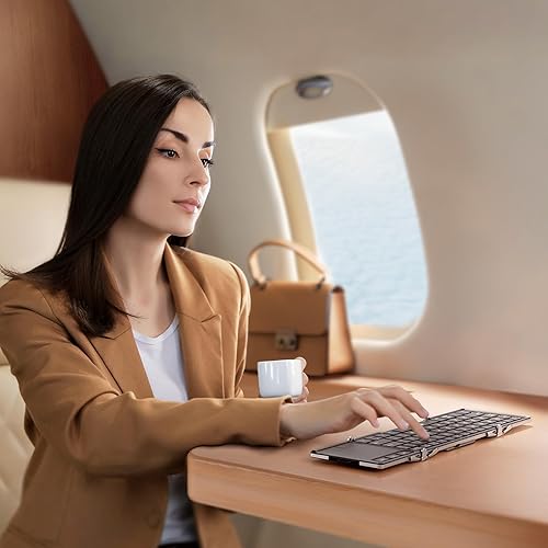 Vista 33 de iClever Teclado inalámbrico plegable en 3 de tamaño compacto de bolsillo (versión inglés) con touch pad sensible (sincroniza hasta 3 dispositivos)