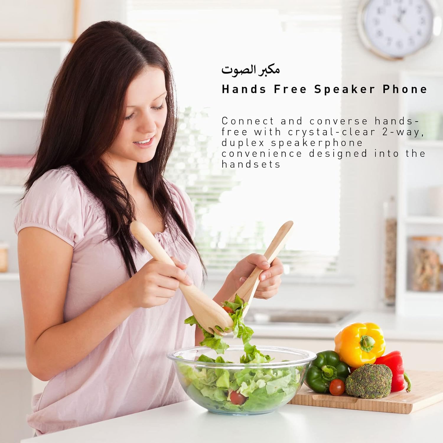 Woman using hands-free speakerphone while cooking