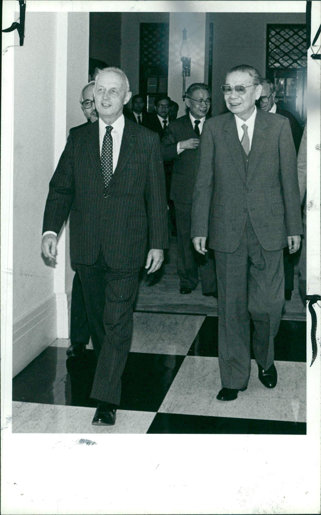 Vintage photo of Governor Youde greeting Ji Pengfei