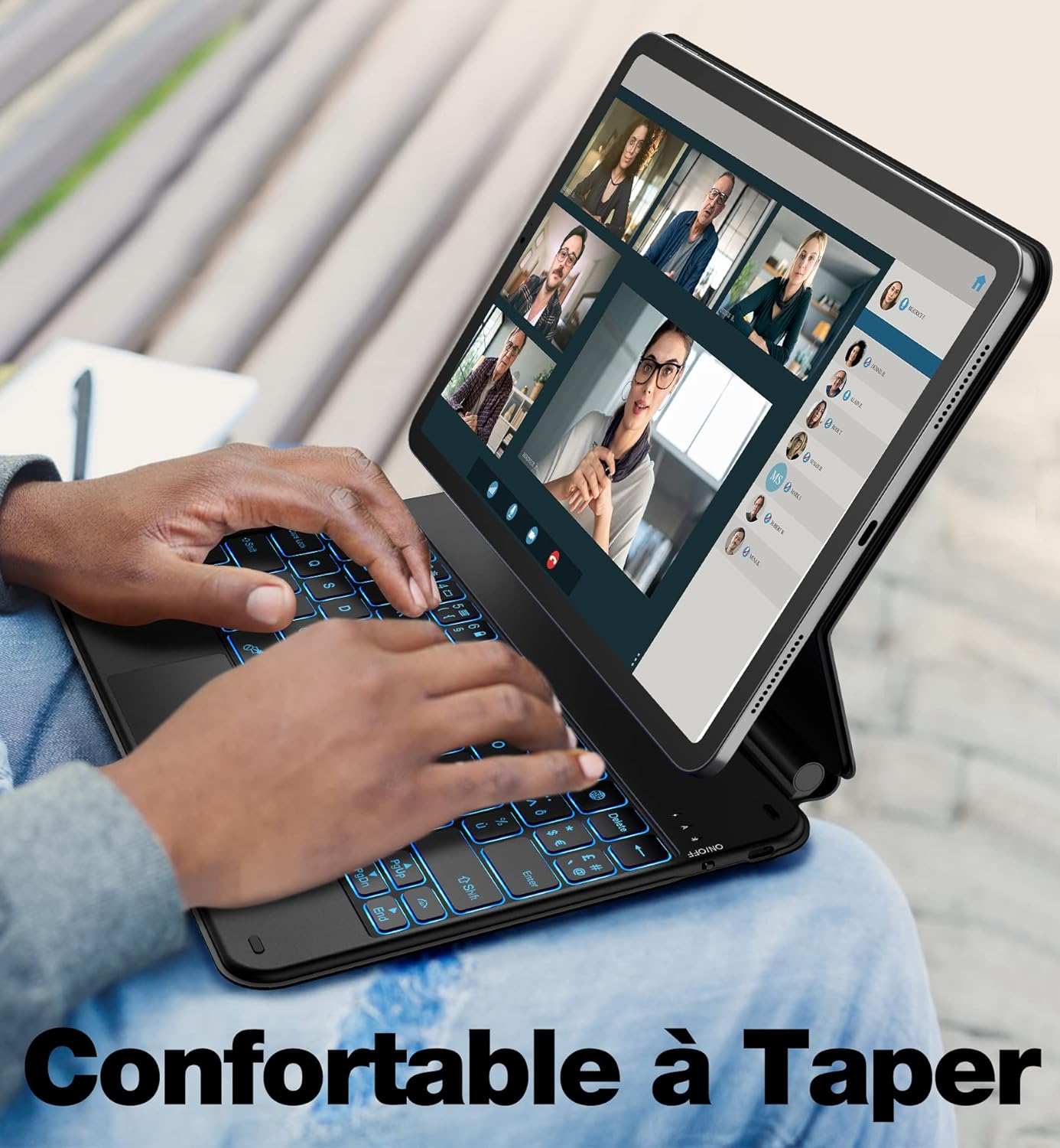 Image of a person typing on the backlit keyboard case