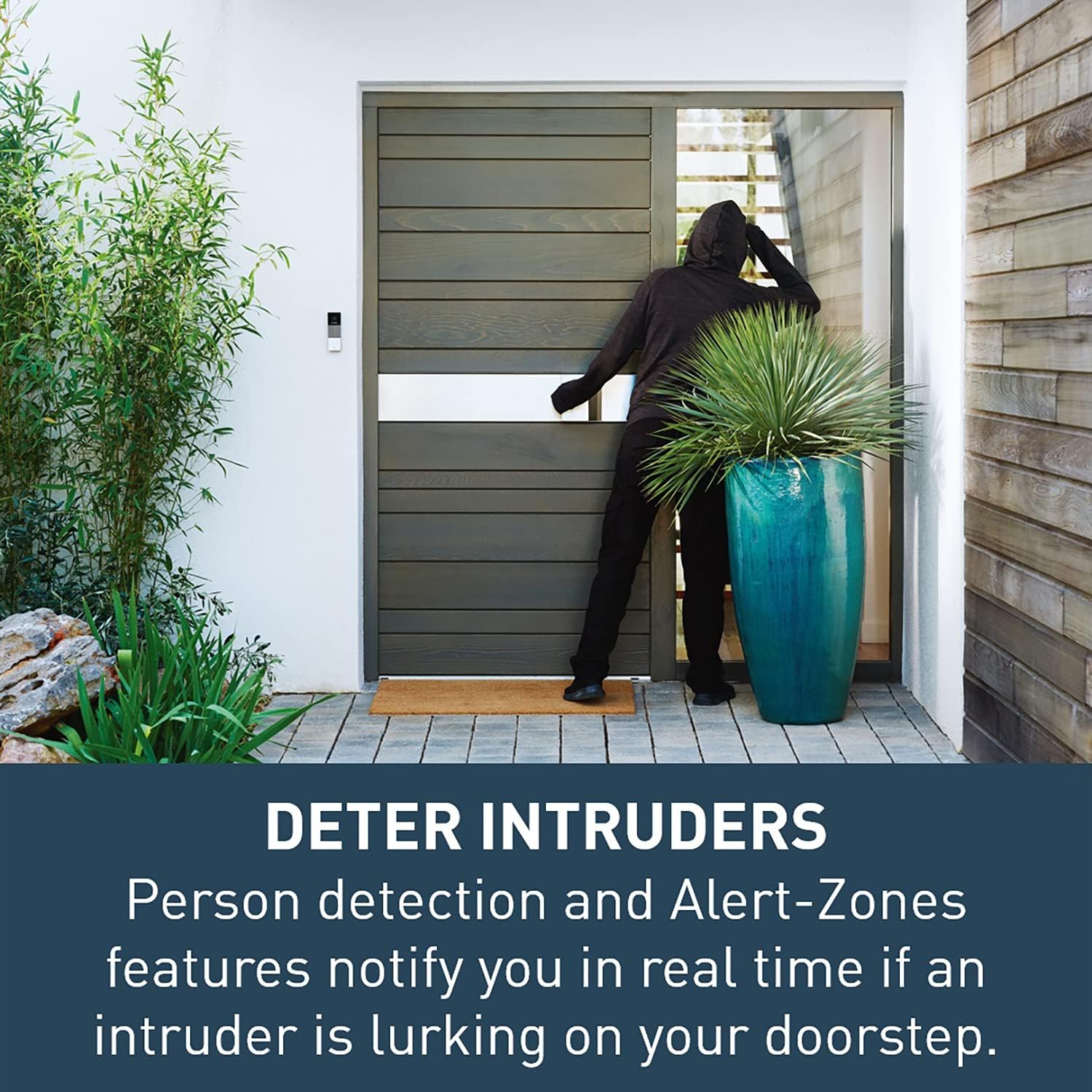Person answering doorbell on smartphone from a distance