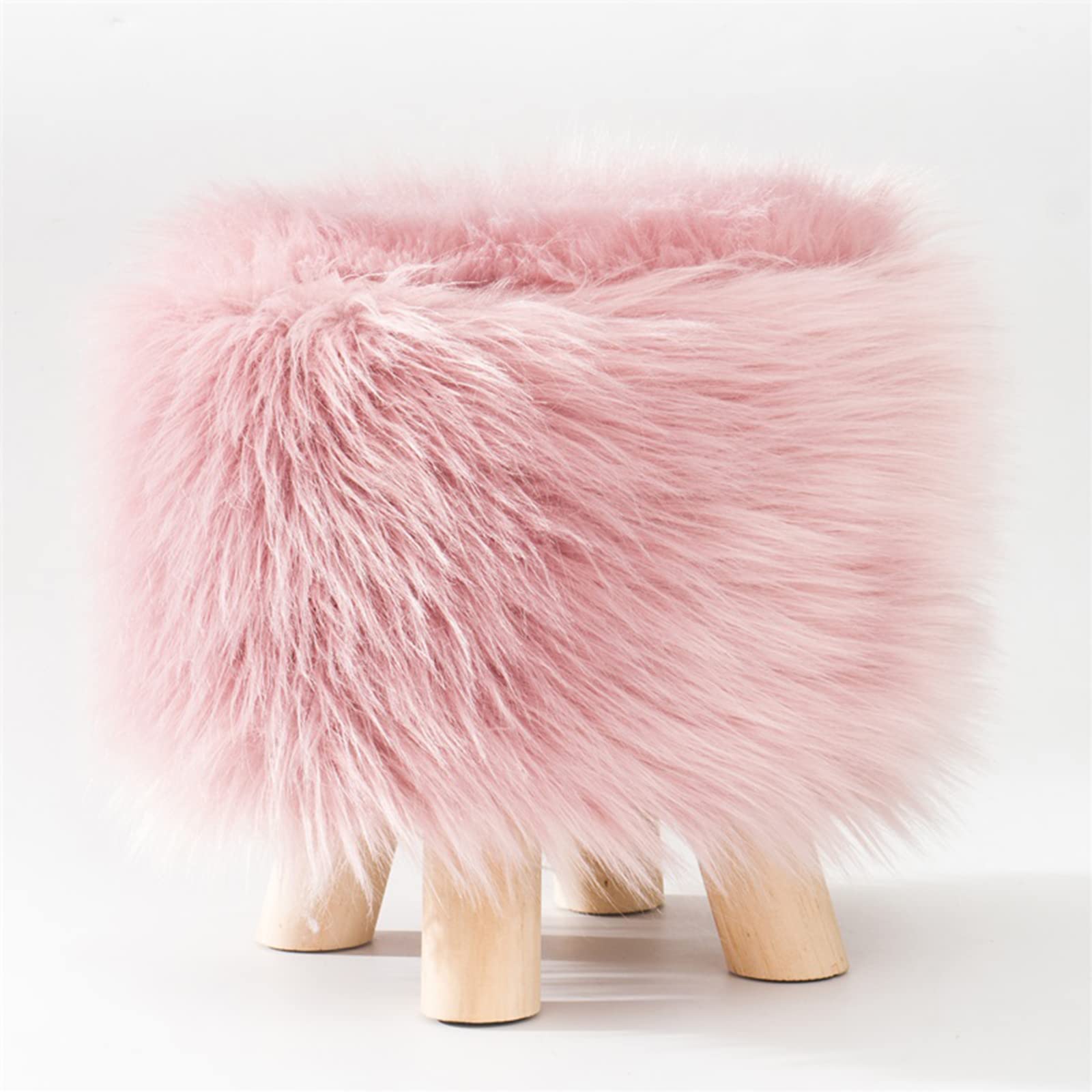 Tabouret rond en fausse fourrure rose idéal pour créer un coin salon cosy