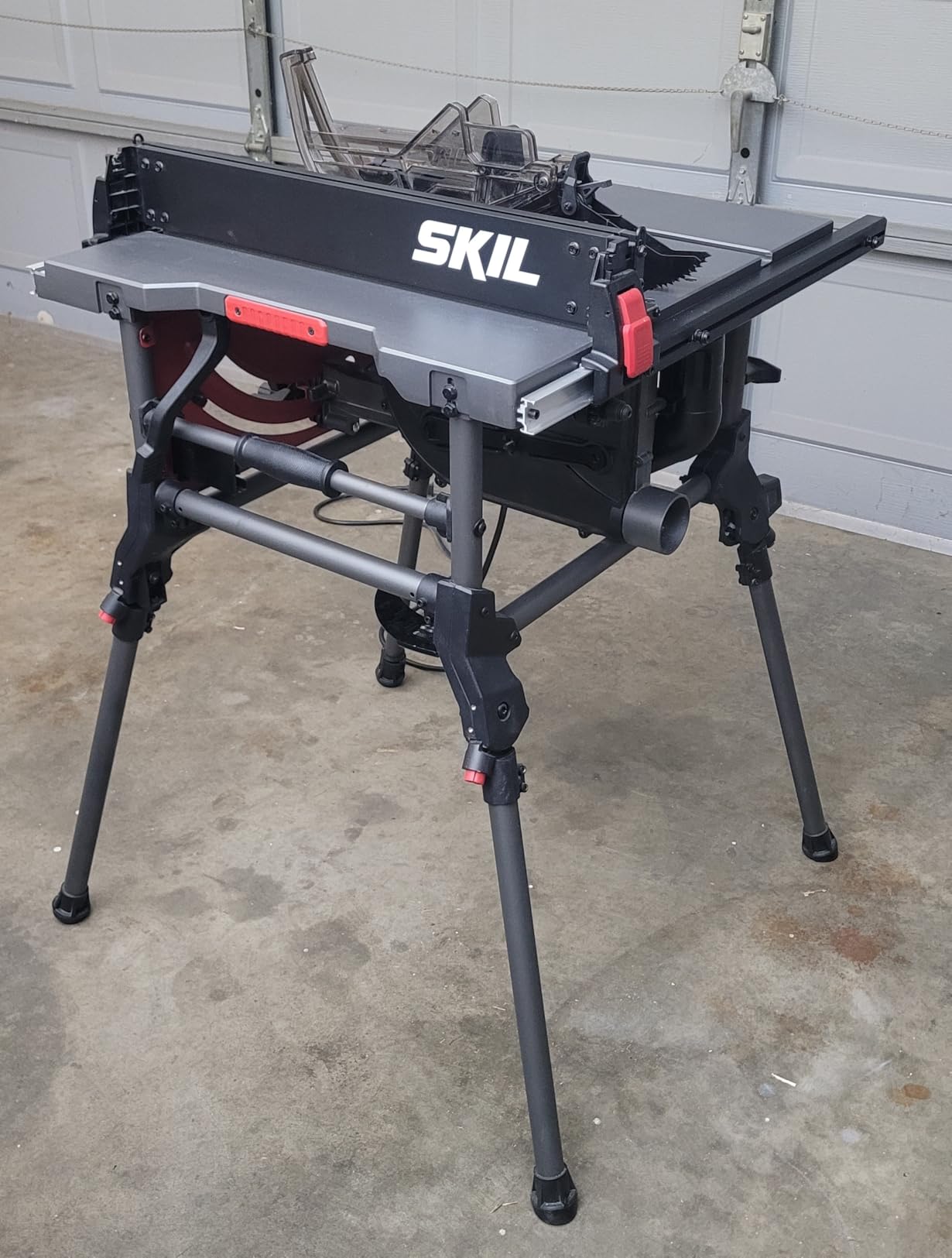 Contractor-style table saw with rip fence and blade guard