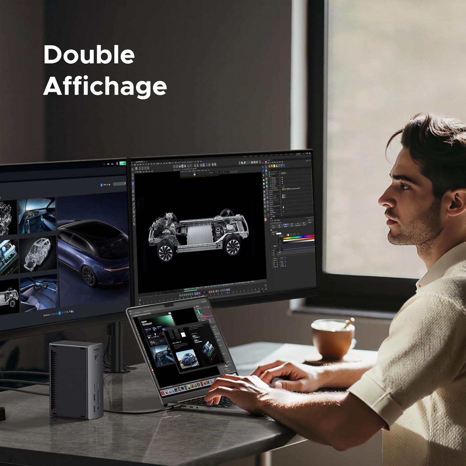 Man working with a laptop connected to the UGREEN dock and two external monitors.