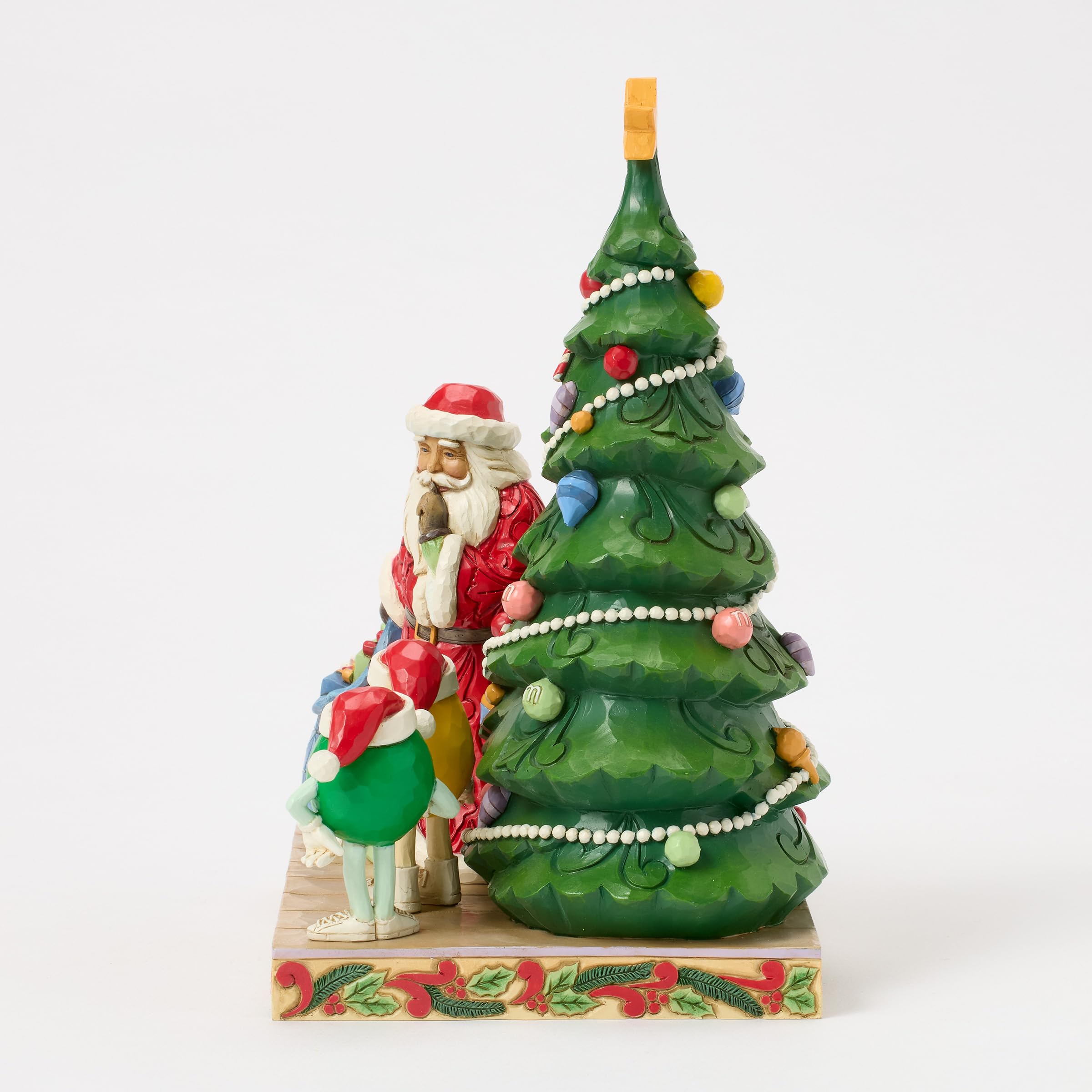 Enesco M&M's by Jim Shore Figurine de Père Noël avec Personnages Verts et Jaunes de Sapin de Noël, 21 cm, Multicolore