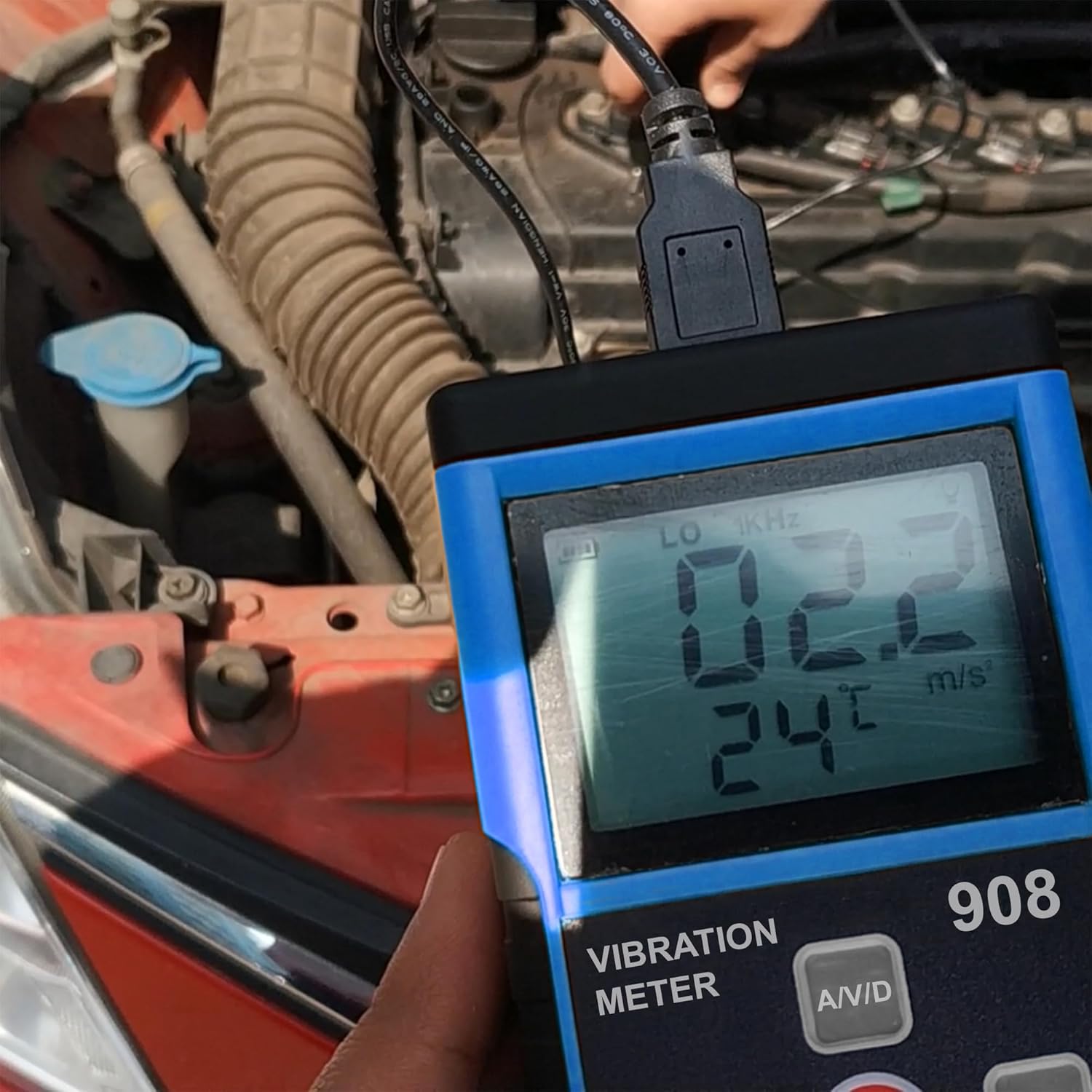 Close-up of Metravi 908 Vibration Meter display showing measurement readings.