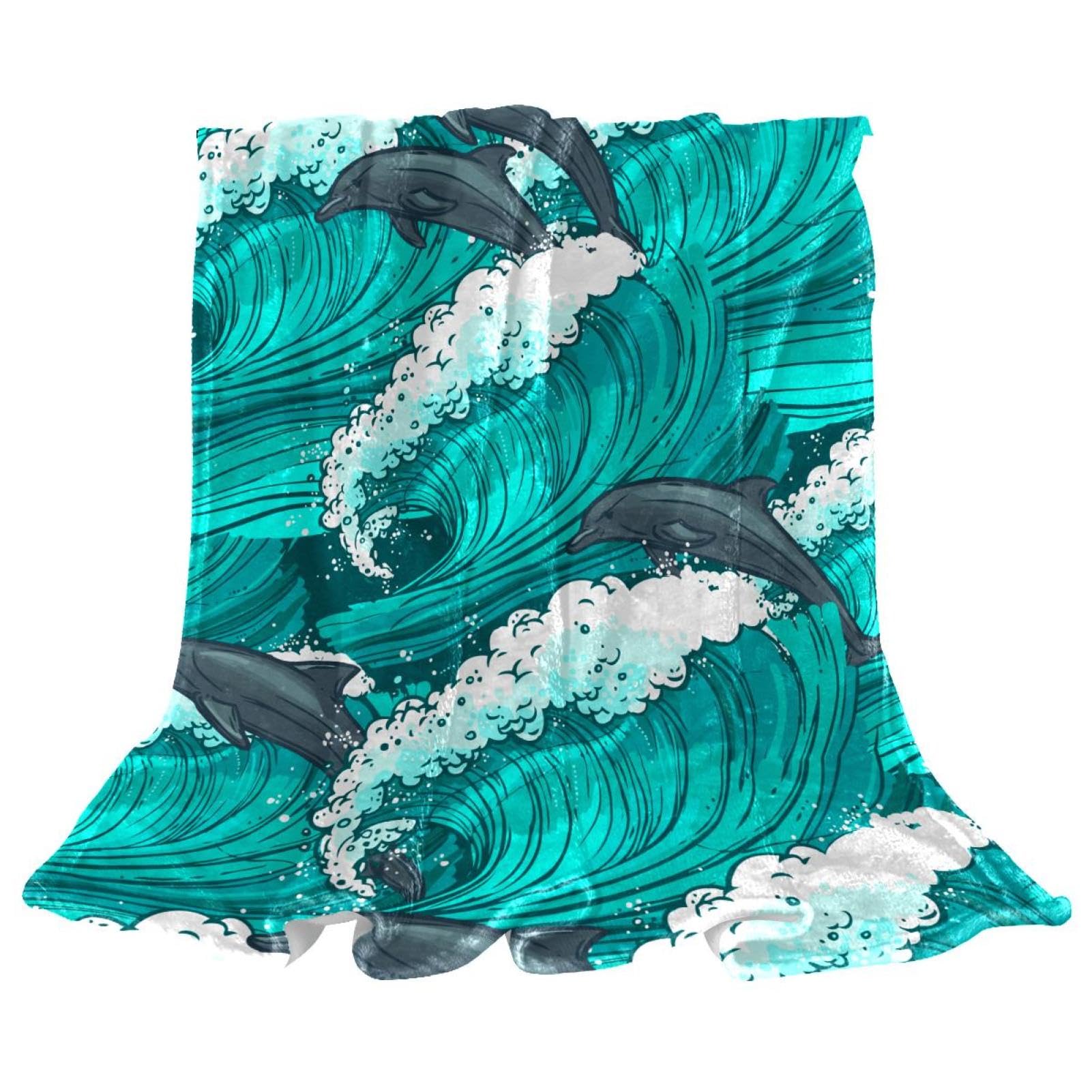 Couverture polaire dauphins pour soirées cocooning sur canapé
