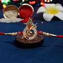 Oblivion Murli Flute Rakhi Set for Brother with Peacock Feather Detail, Heart Shaped Chocolate 32 g, Silver Colour Pooja Coin, Roli and Chawal and Greeting Card gallery image