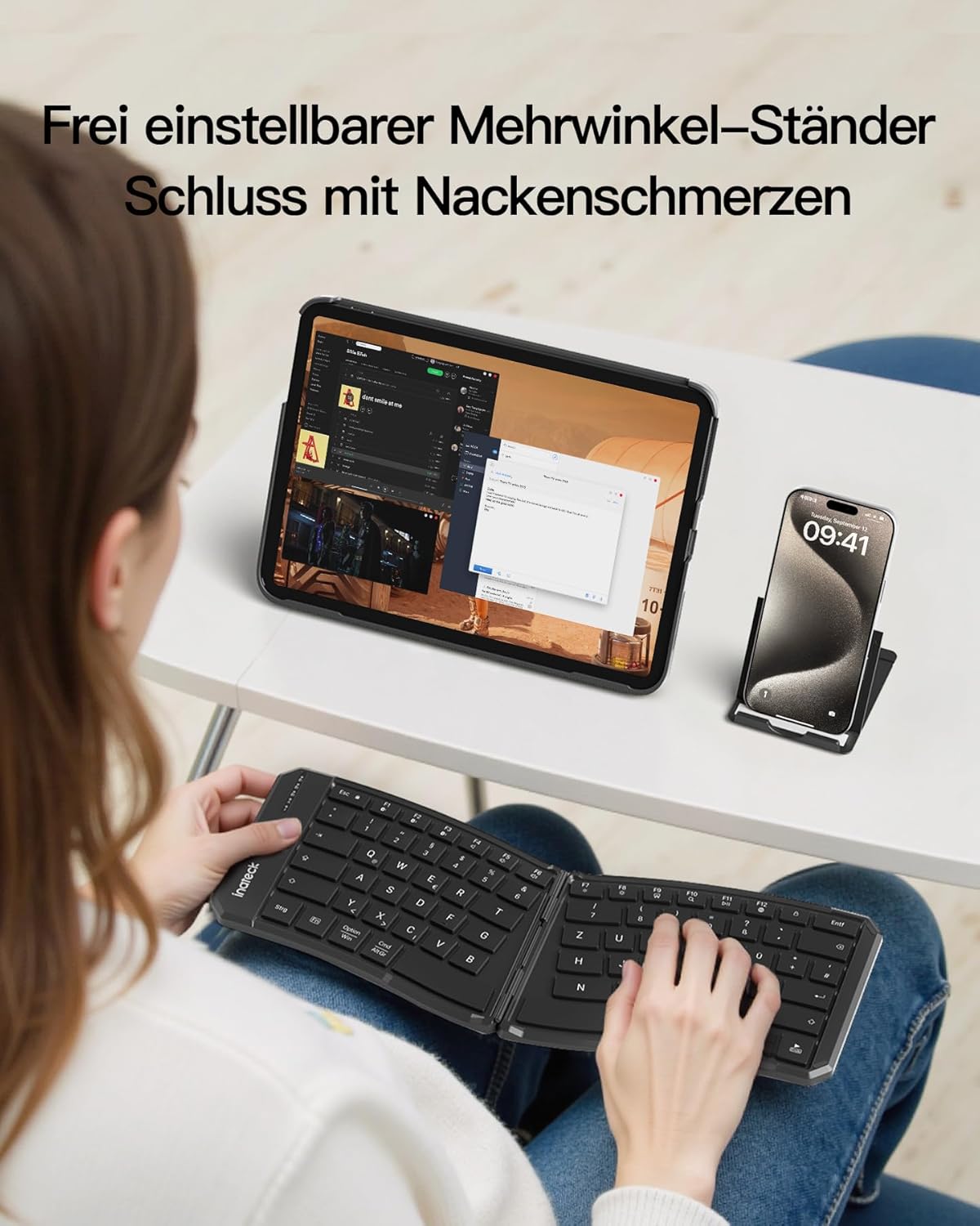 User utilizing the adjustable stand with a tablet and smartphone alongside the Inateck Nomad Ergo N0131 keyboard