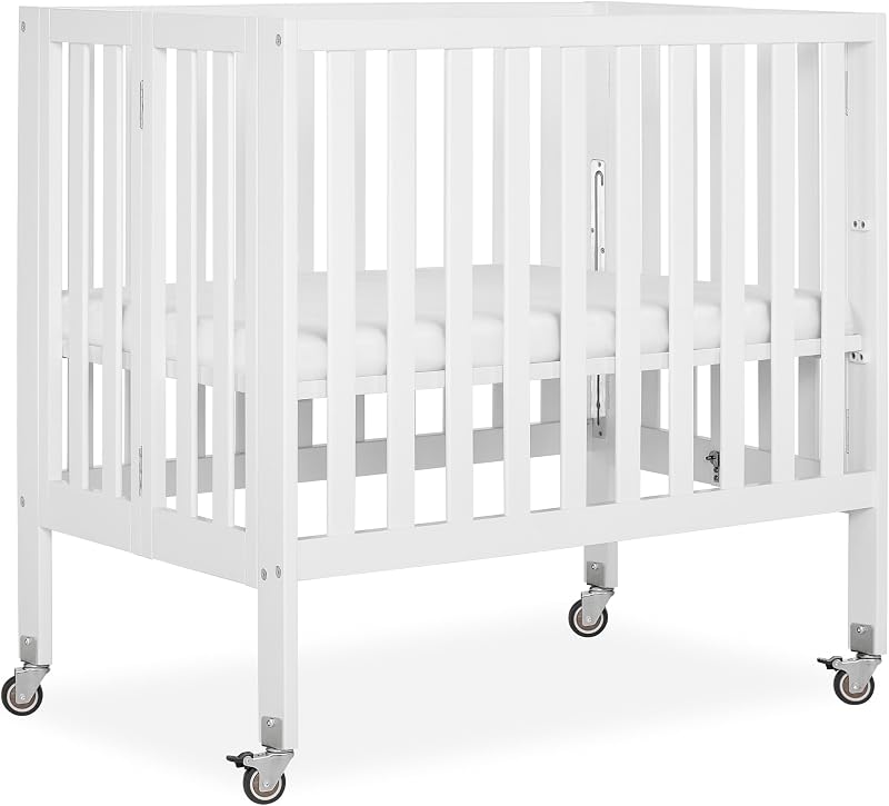 Jett Mini Folding Baby Crib in White, GreenGuard Gold & BSA, Lightweight & Portable, Patented Flat Folding System for Small Spaces & Travel, 1.5” Mattress Pad, 3 Heights, Safe Wheels
