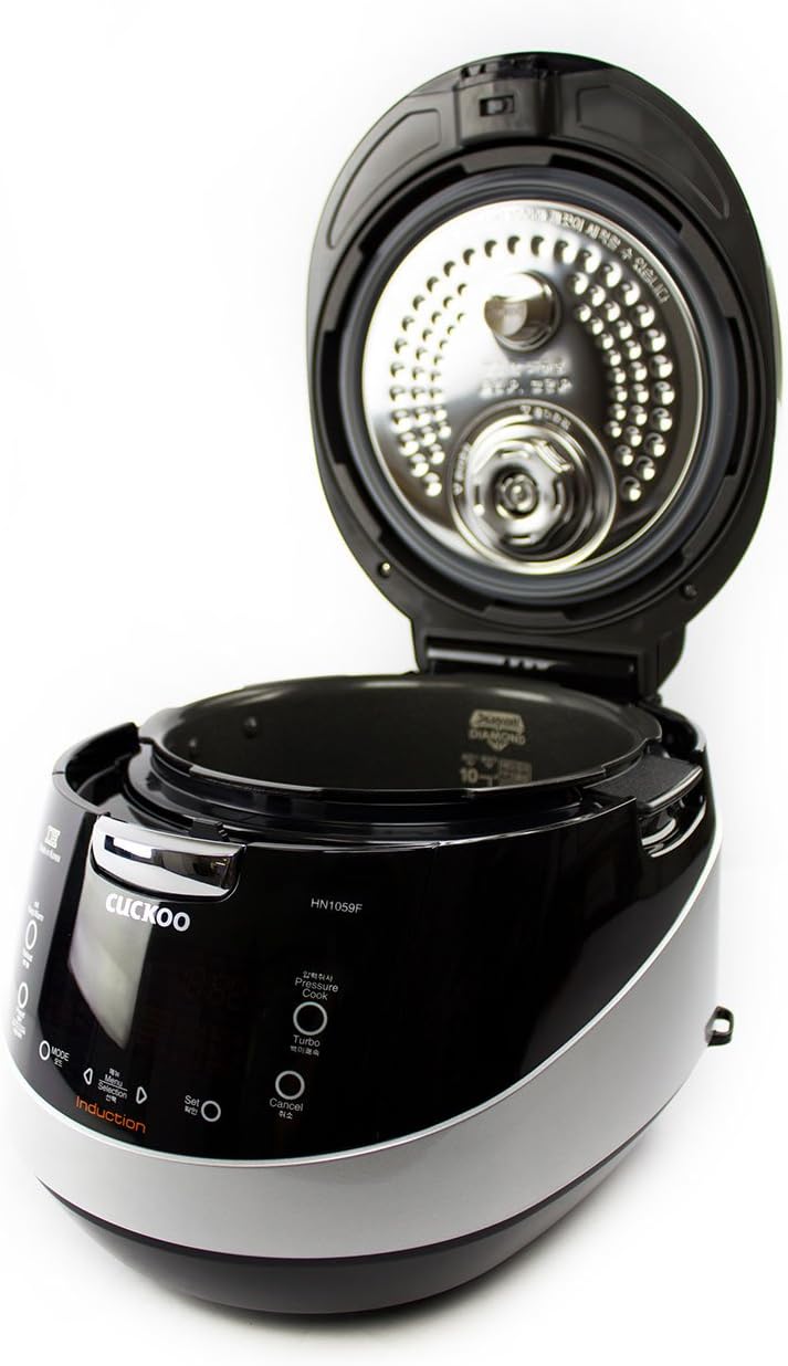 Cuckoo CRP-HN1059F Pressure Rice Cooker with lid open, showing the inner pot and removable inner lid.