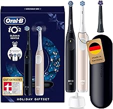 Oral-B iO Series 2 Electric Toothbrush - Twin Pack - Electric Toothbrush, Includes 3 Replacement Toothbrush Heads, Travel Case - 3 Cleaning Modes for Dental Care, Well Tested (2.2) by STIFTUNG WARENTEST, Black/Pink