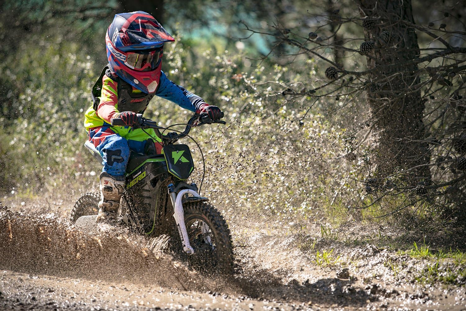 Young rider on KUBERG Cross Hero in muddy conditions