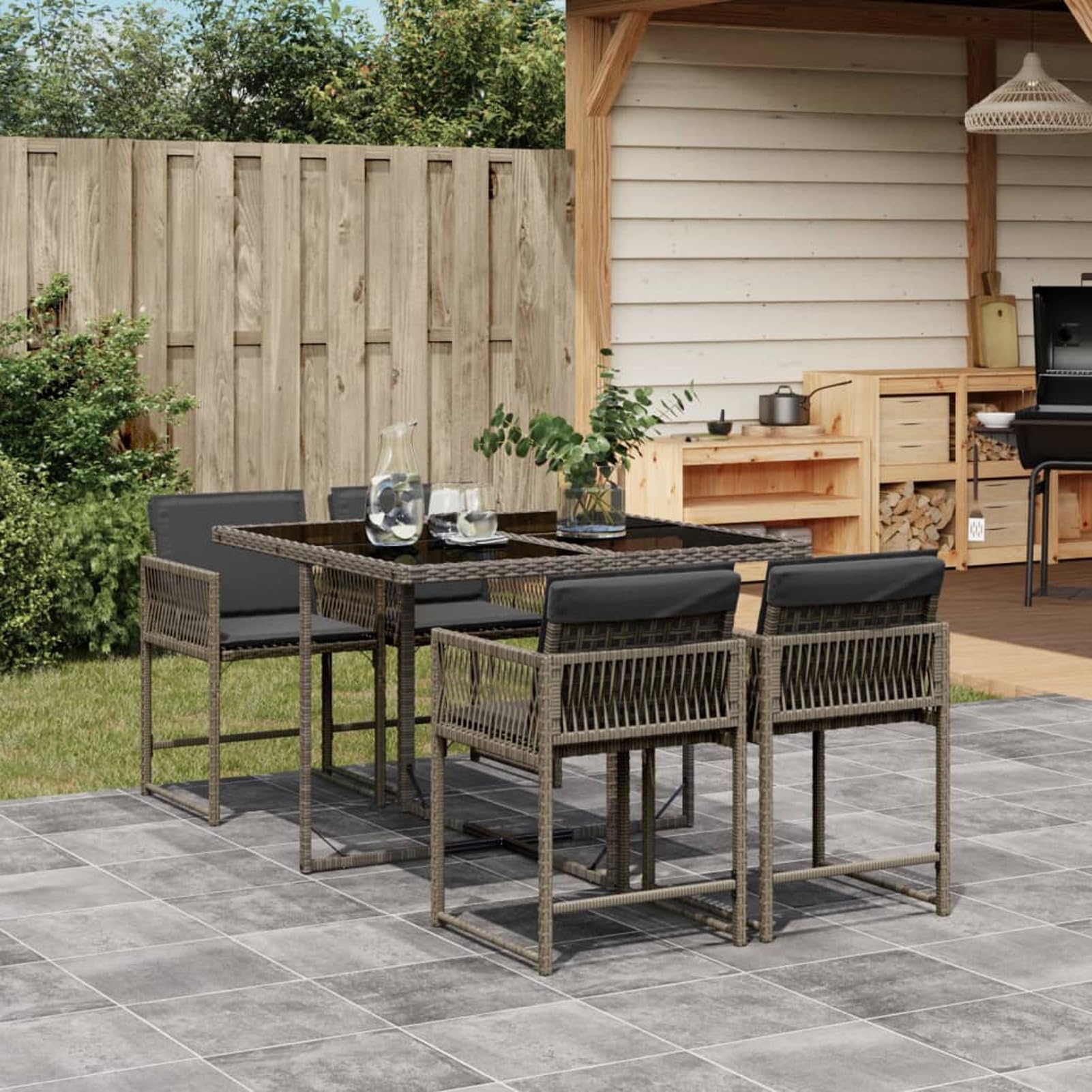 Mesa y 4 sillas de jardín de ratán gris para cenas al aire libre en tu terraza