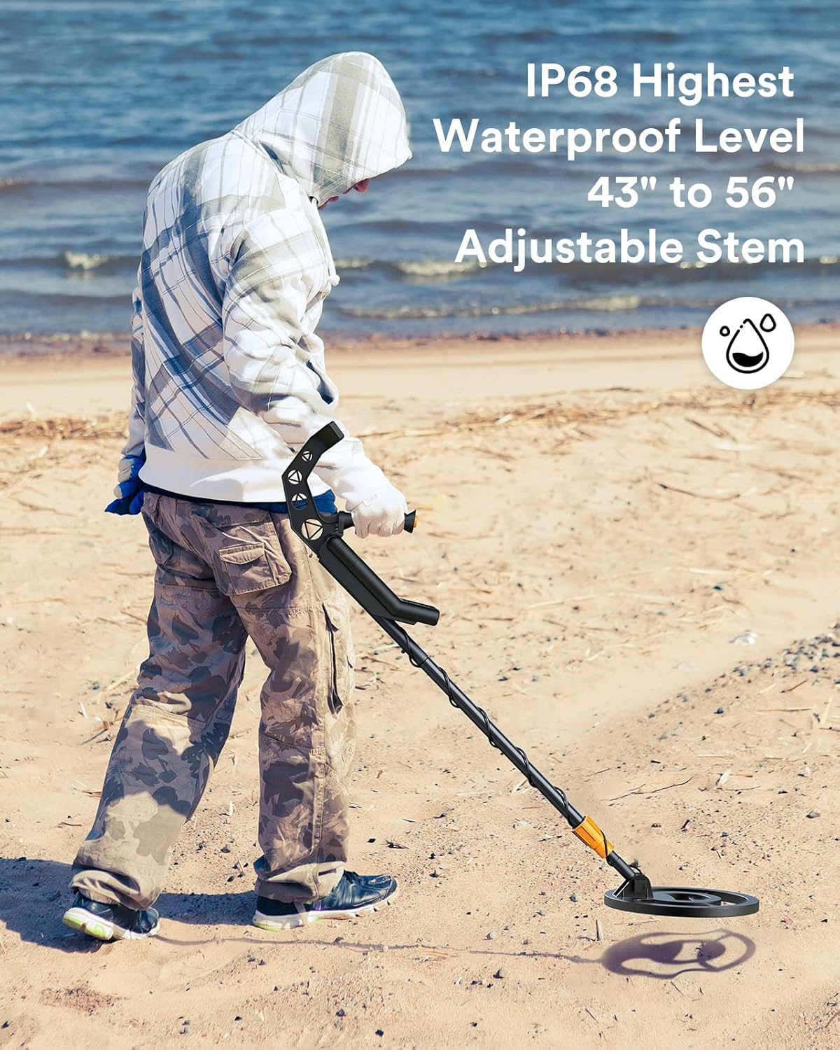 A person using the metal detector on a beach, emphasizing its IP68 waterproof level and adjustable stem.