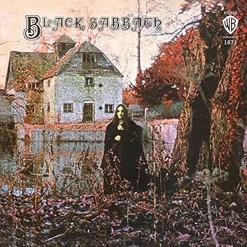 Black Sabbath by Black Sabbath album cover 1970 featuring mysterious woman in front of watermill
