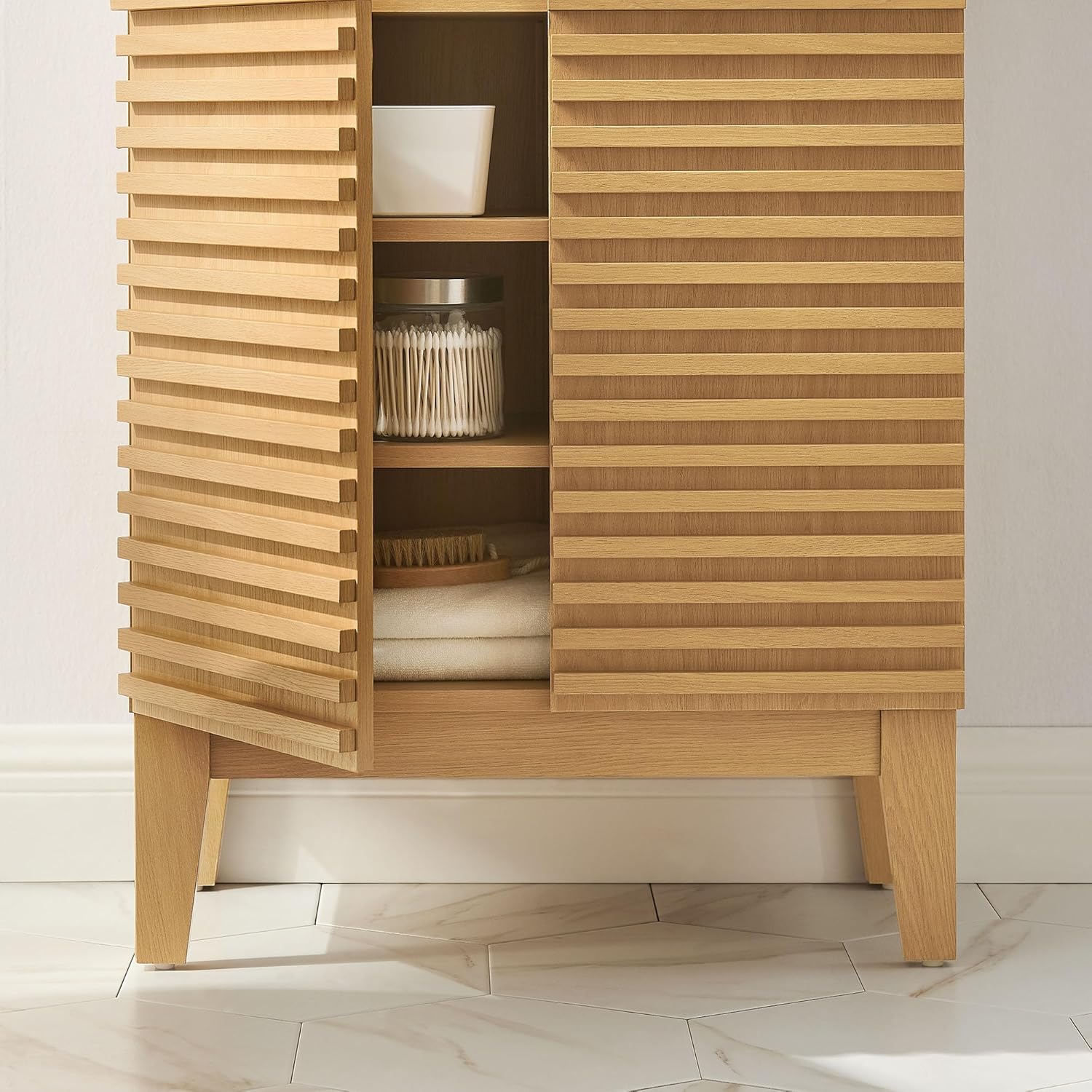 Modway Render cabinet interior with various bathroom items stored on shelves.