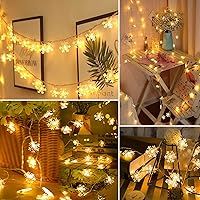 Vista 3 de BrizLabs Luces de copo de nieve, 40 luces LED de Navidad de 16.08 pies con control remoto, cadena de luces parpadeantes de copo de nieve funciona