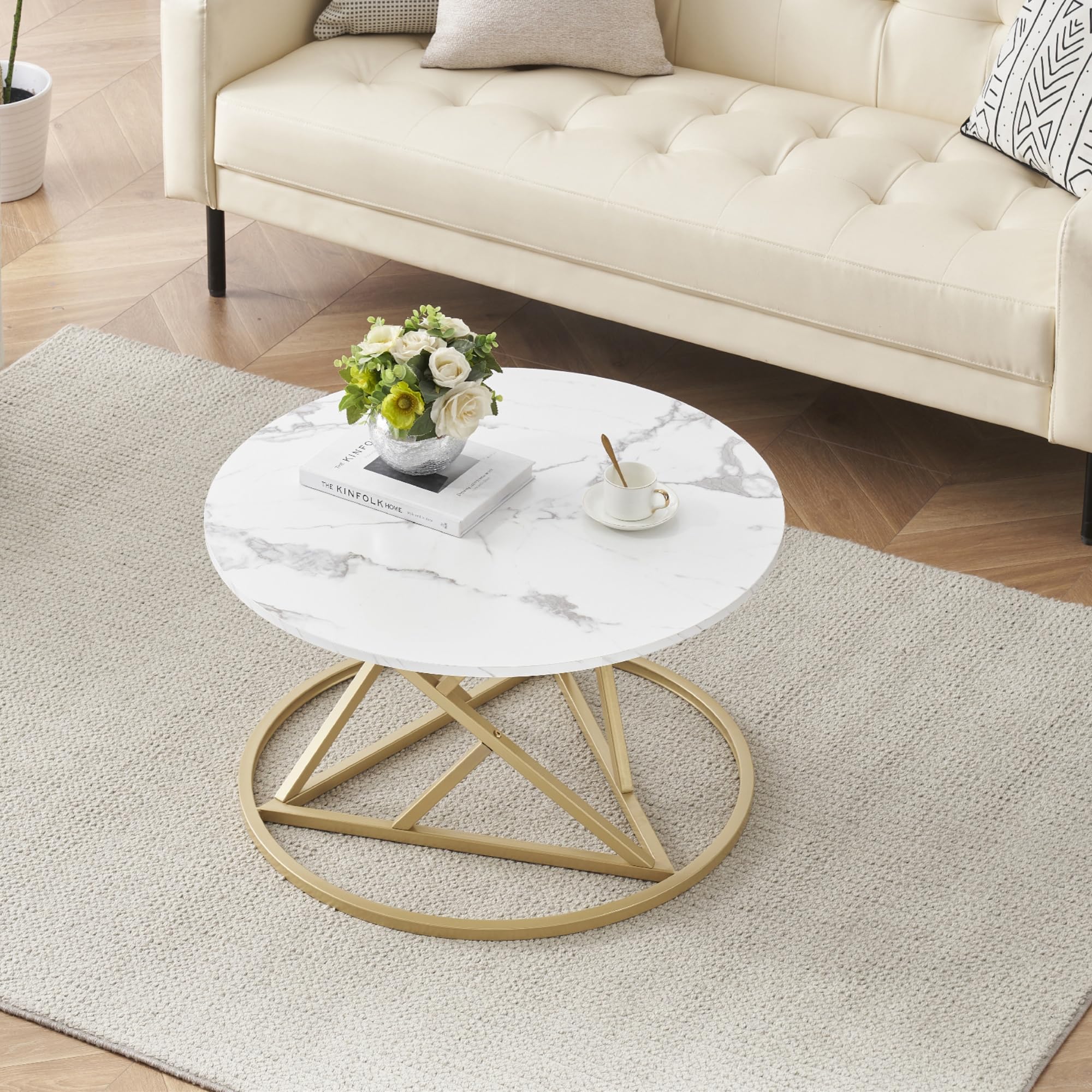 Mesa de centro redonda con tapa de mármol blanco y base dorada