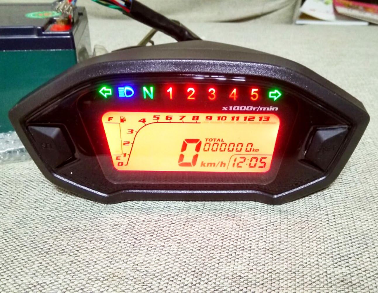 SAMDO LCD Universal Motorcycle Speedometer displaying speed, RPM, gear, fuel, and time