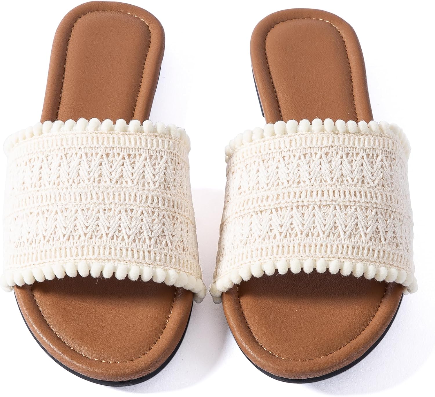 Flat braided leather sandals in nude for dressy summer occasions.