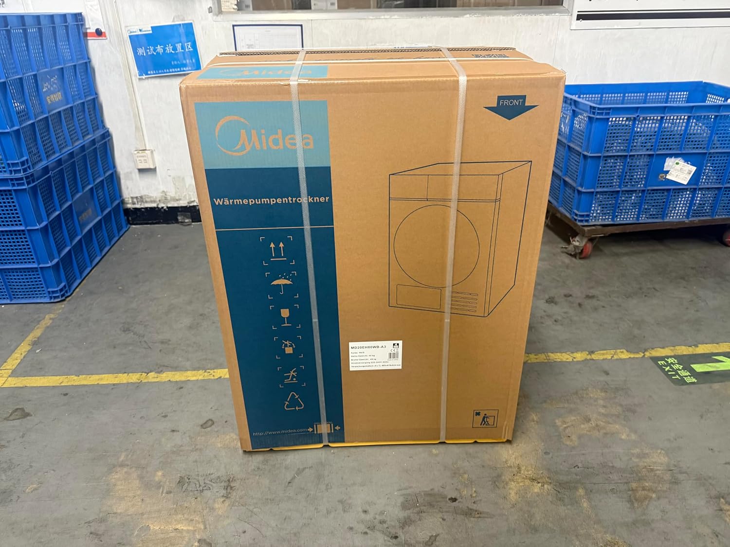 Midea heat pump dryer in its cardboard packaging