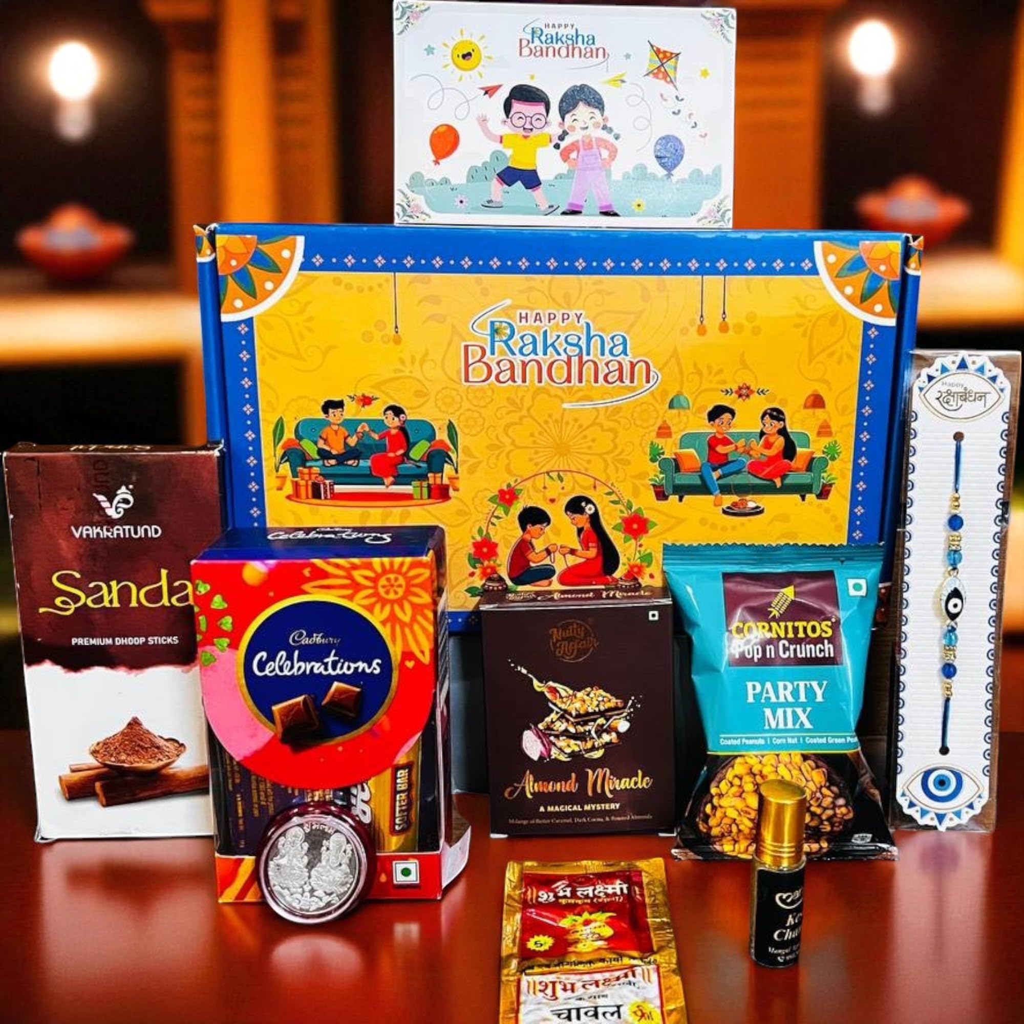Mobison Rakhi Gift Combo Box for Brother Bhaiya & Bhabhi-9 Inclusions + Evil Eye Rakhi Nazar Kavach|Chocolate,Millet Namkeen,Almond Bar,Incense Sticks & Stand,Perfume,Coin,Card,Roli Chawall-image-5