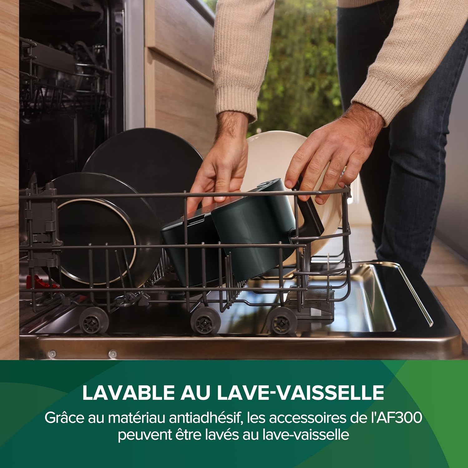 A person placing the air fryer basket into a dishwasher.