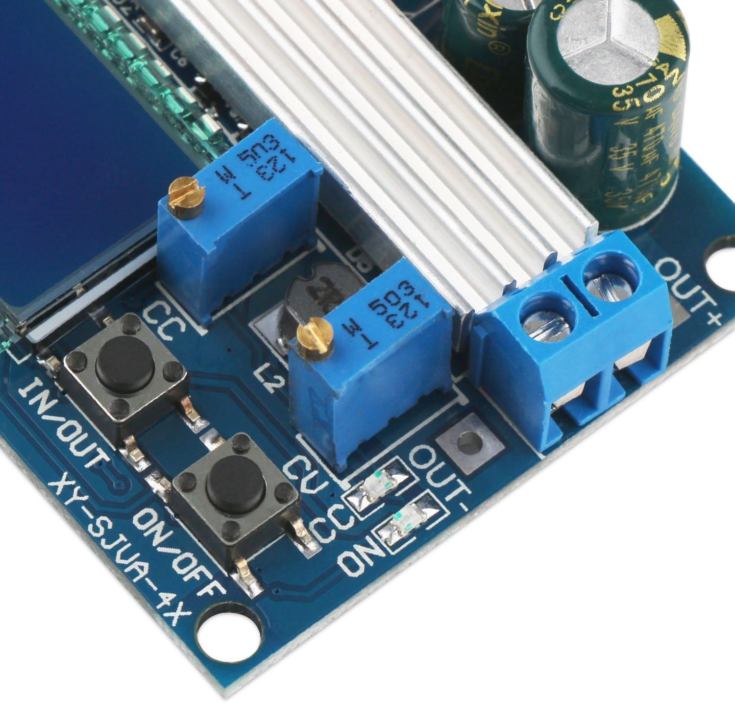 Primer pla view of the adjustment potentiometers and control buttons on the DROK buck-boost converter module.