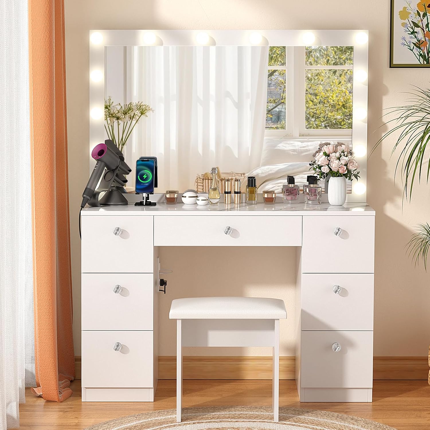 Close-up of the vanity's built-in power outlet with two standard sockets and two USB ports.
