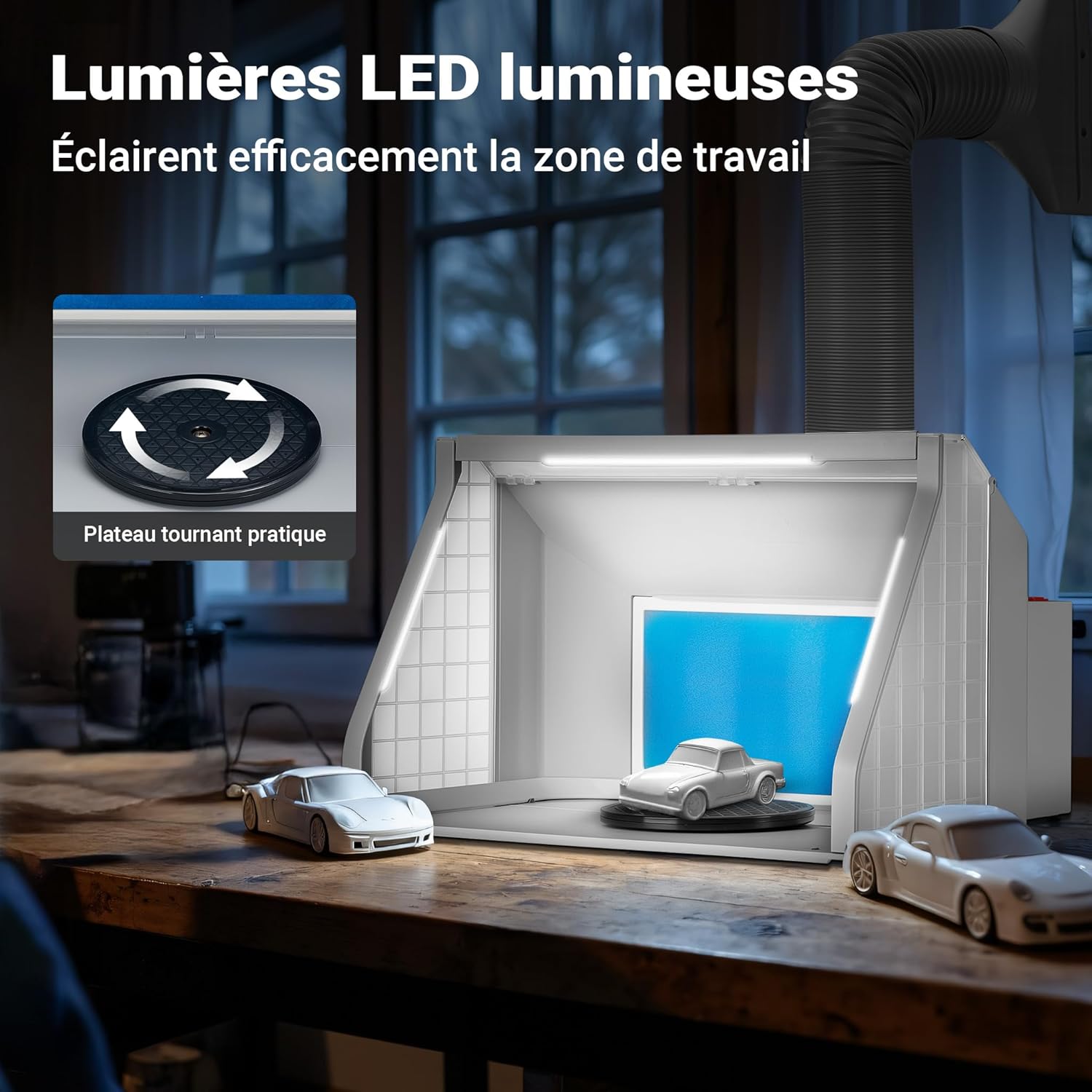 The Wiltec Airbrush Extraction System with its bright LED lights illuminating the interior, and a model car on the rotating turntable.